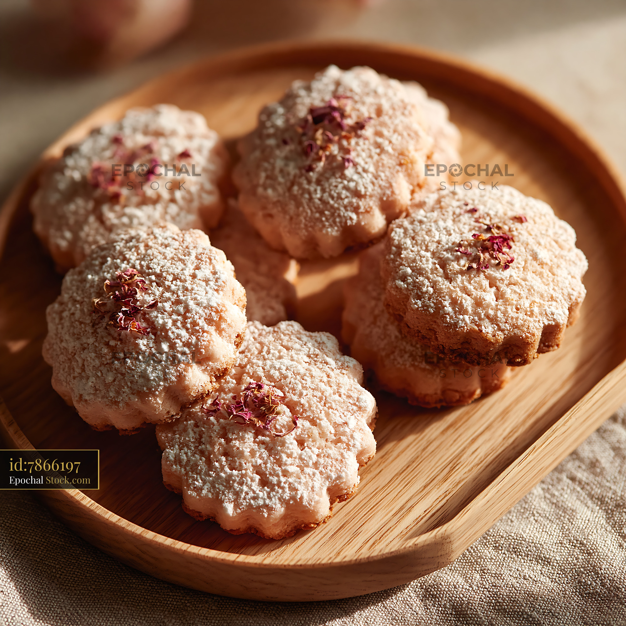Rose water biscuits with powdered sugar and dried petals on wooden tra - stock photo