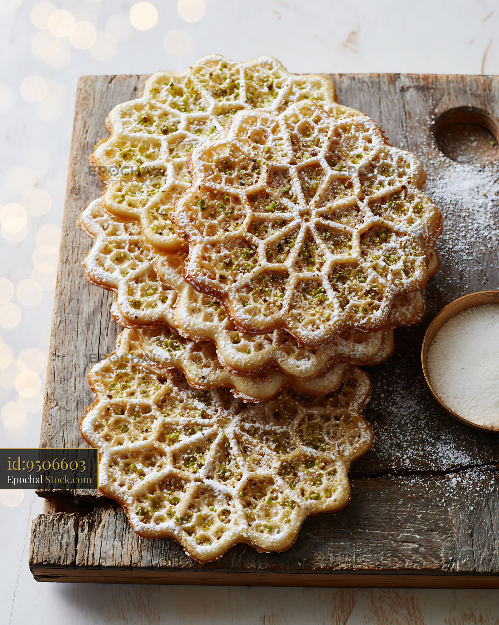 Traditional nan-e panjereh biscuits with powdered sugar and pistachios - stock photo