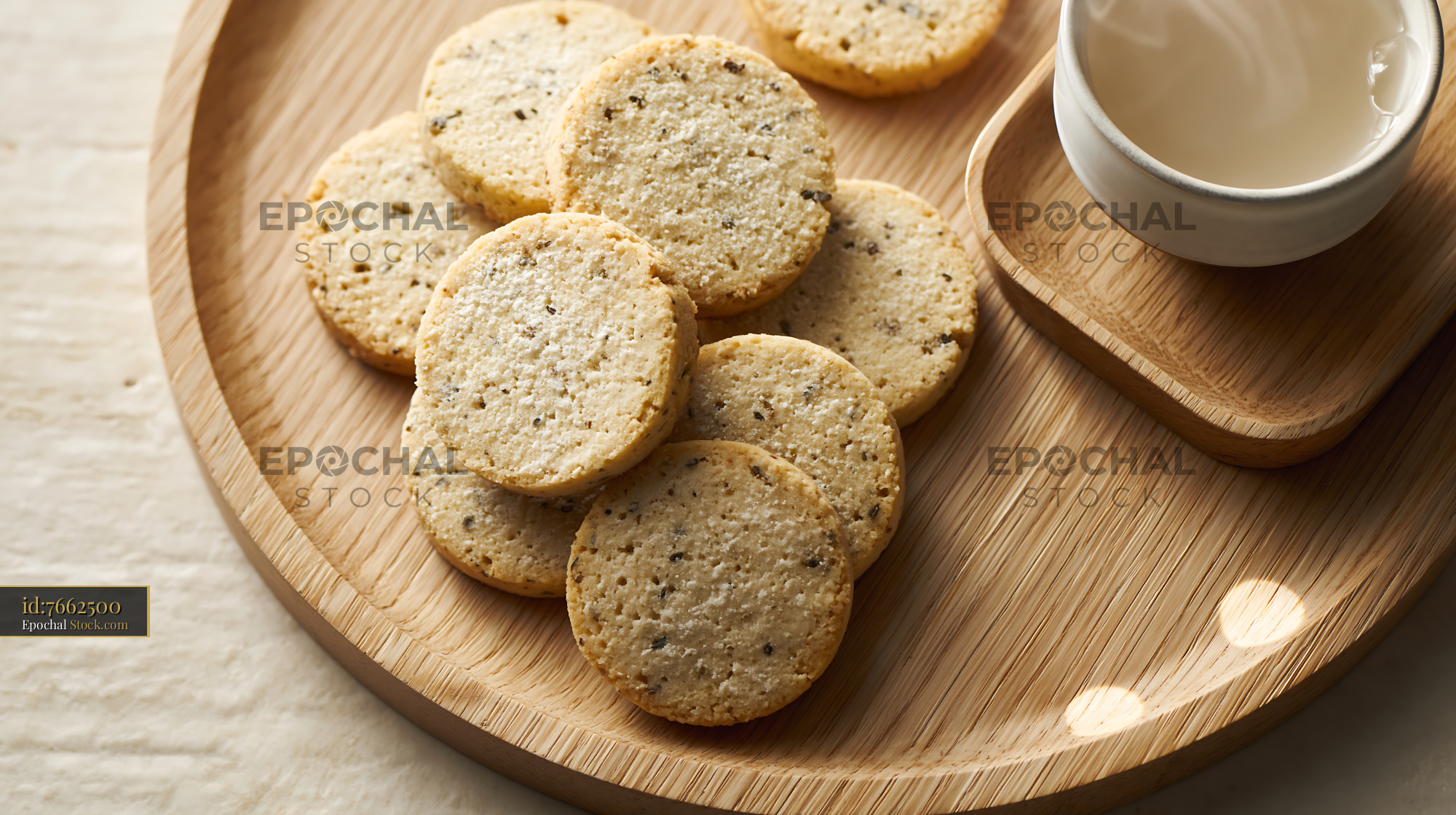 Stack of homemade cardamom chickpea biscuits on a wooden tray - stock photo