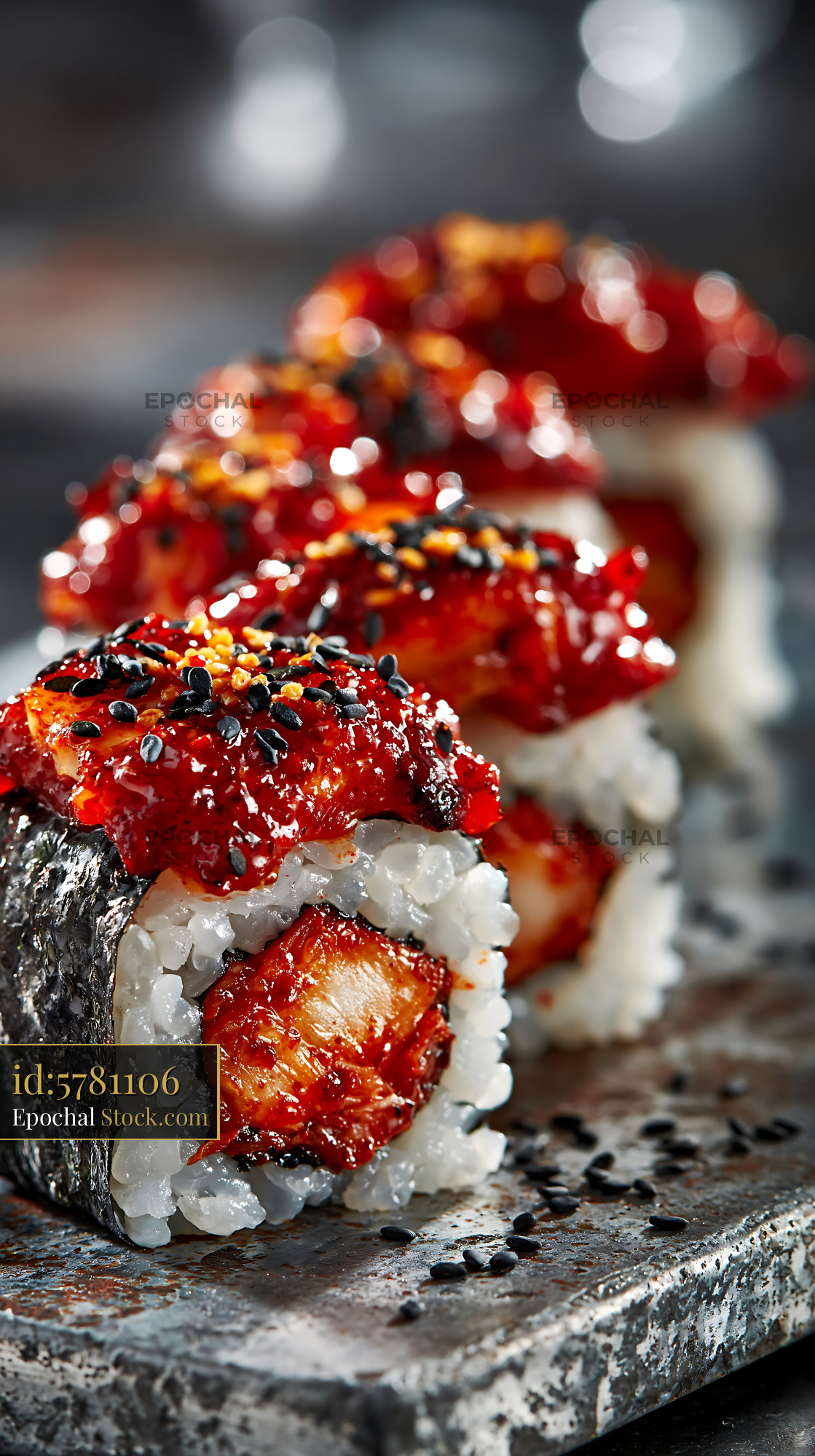 Kimchi fusion maki sushi rolls with spicy red glaze and sesame seeds - stock photo