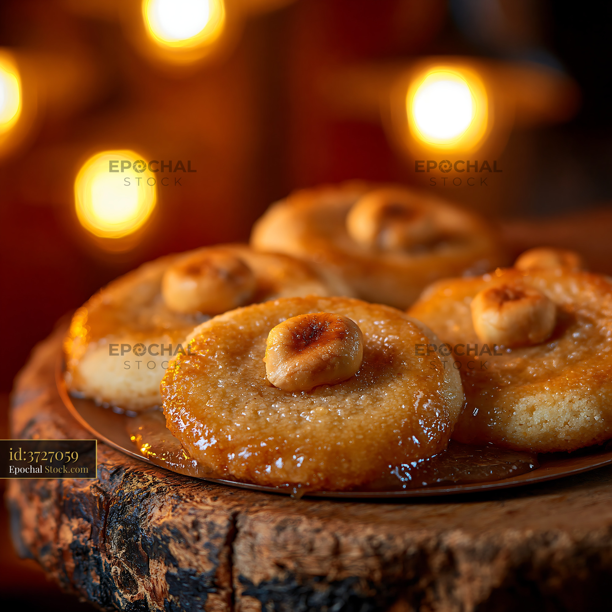 Sekerpare hazelnut biscuits soaked in syrup on a rustic wood board - stock photo