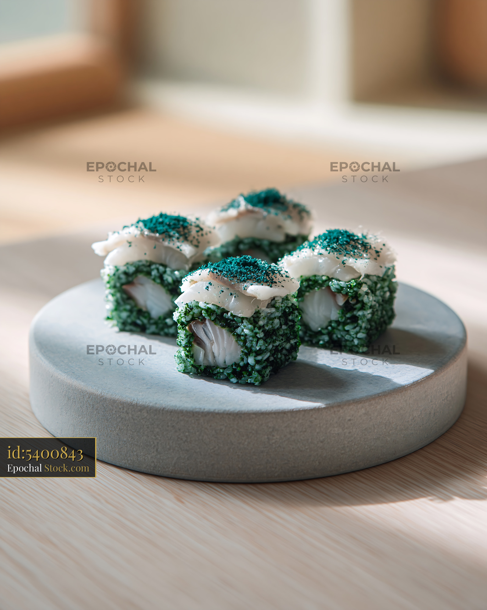 Modern sushi rolls with spirulina powder and fresh white fish - stock photo