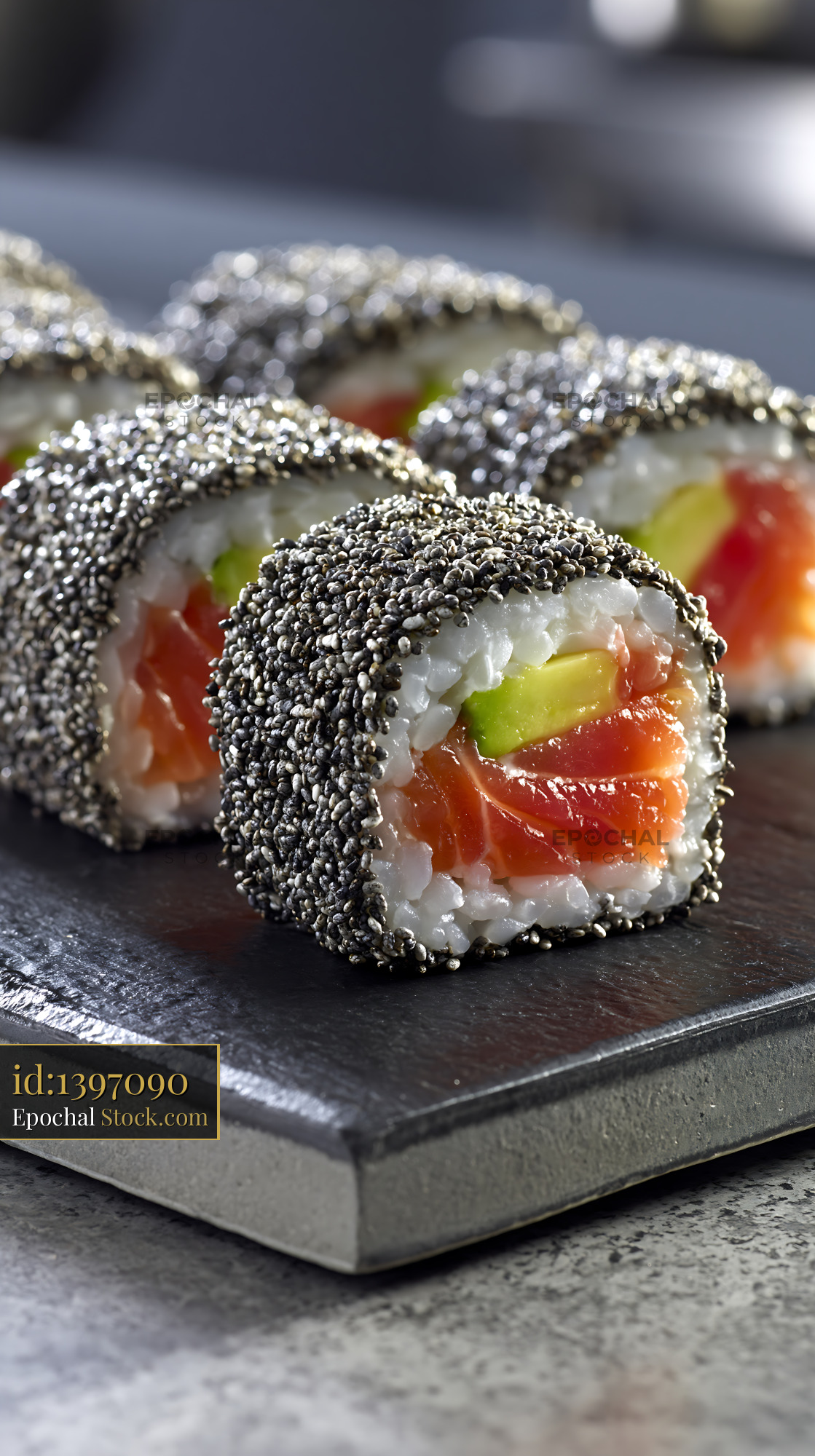 Chia seed crusted sushi rolls with fresh salmon and avocado - stock photo