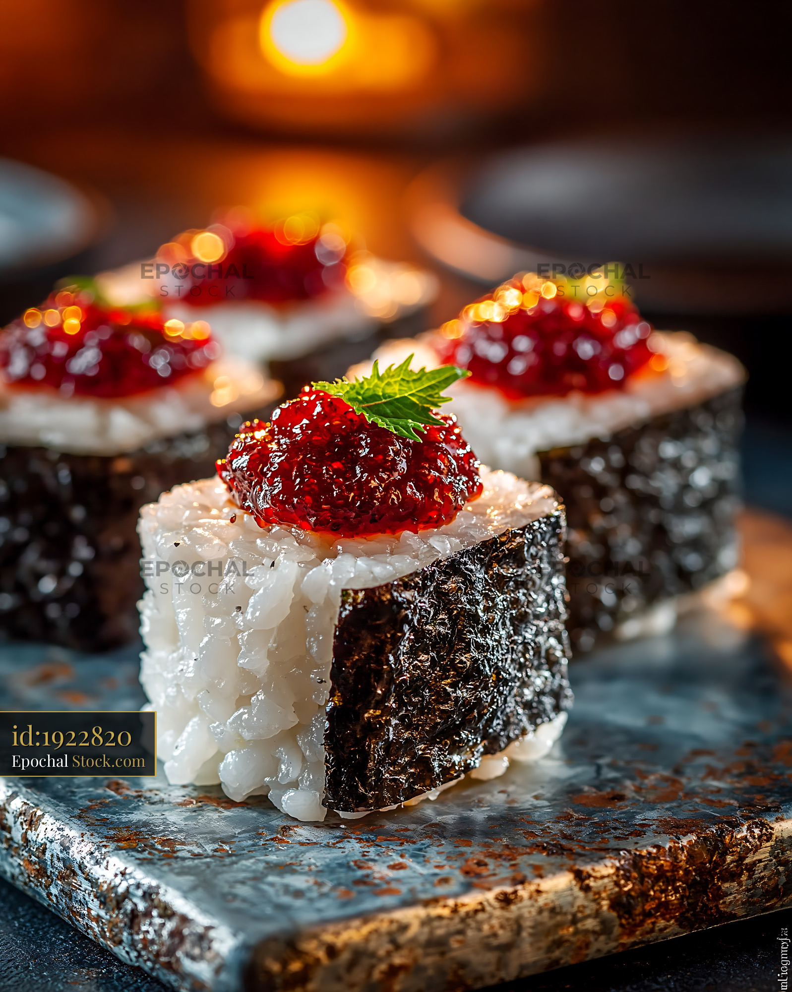 Salted plum umeboshi sushi rolls on a rustic stone platter - stock photo