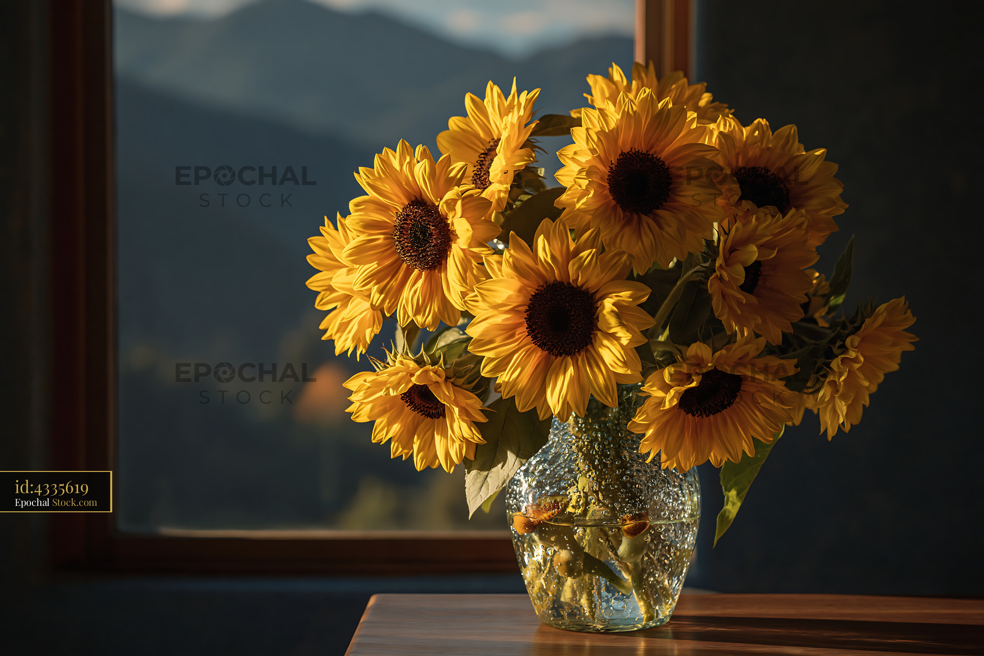 Sunflower bouquet in glass vase on wooden table with mountain view - stock photo