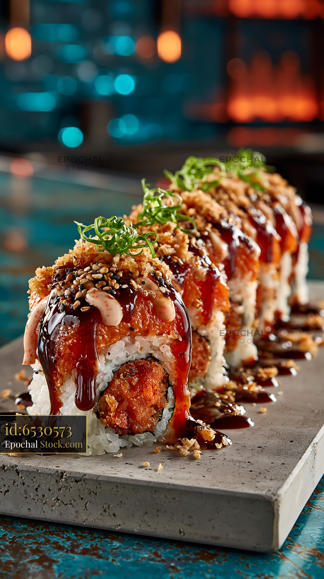 Sweet potato crunch sushi rolls with unagi sauce and scallions - stock photo