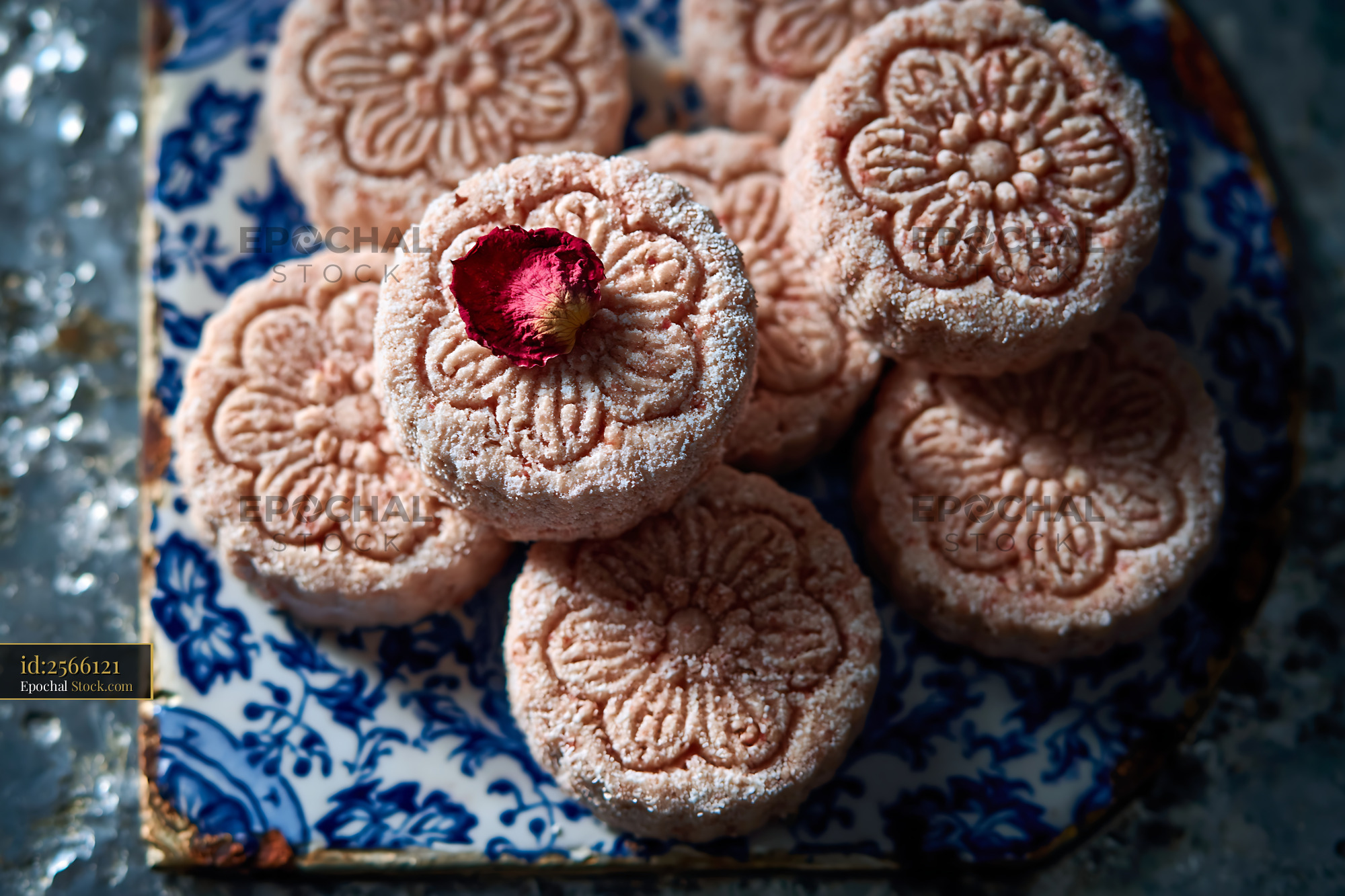 Artisanal rose water biscuits with floral patterns and a rose petal - stock photo