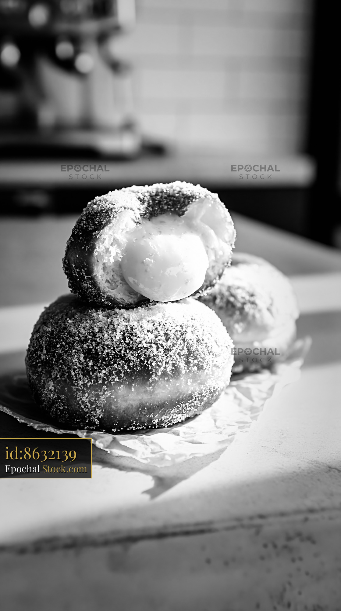 Sugar coated yuzu curd filled donuts in a rustic cafe setting - stock photo