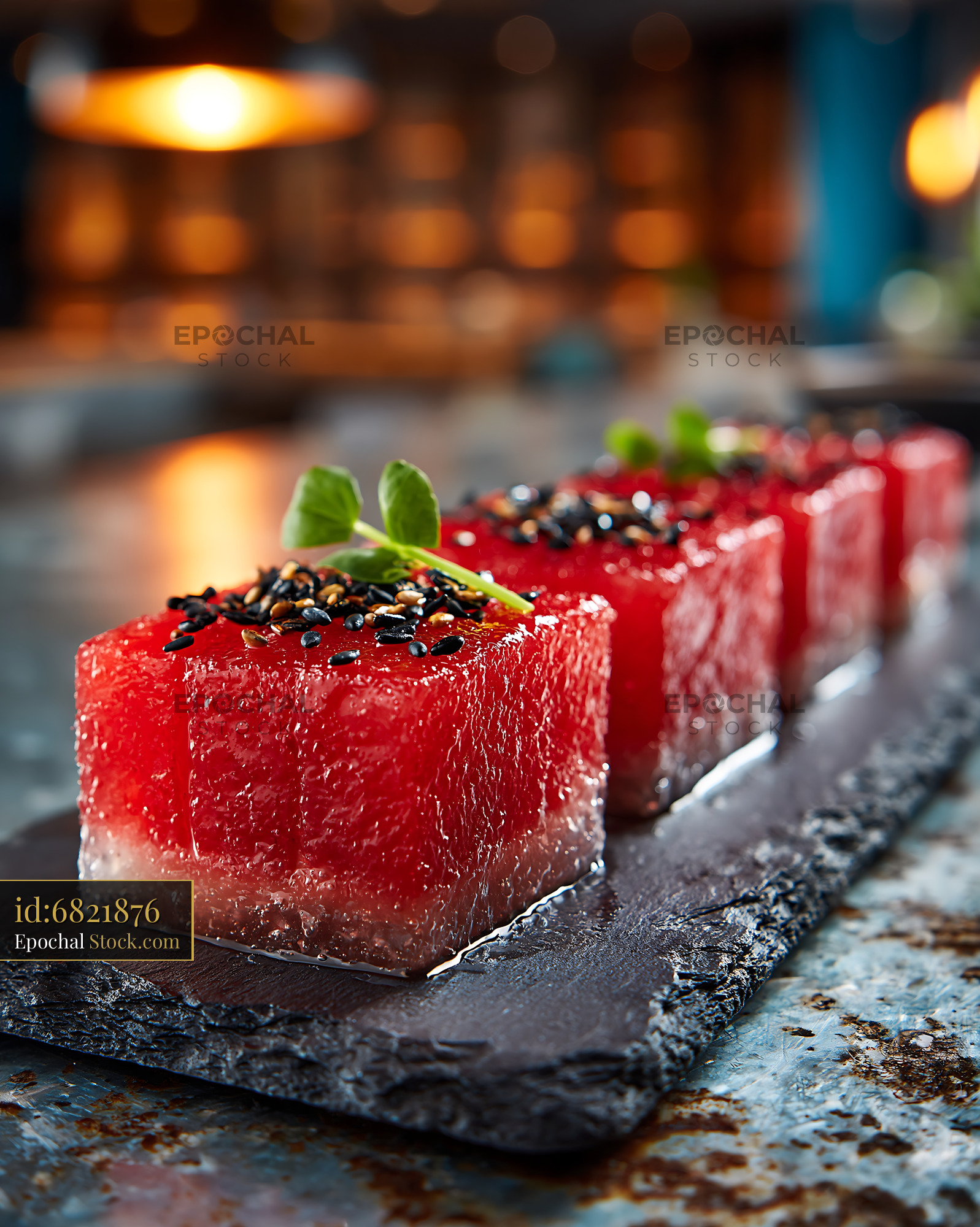 Vegan watermelon tuna sushi cubes with sesame seeds on slate - stock photo