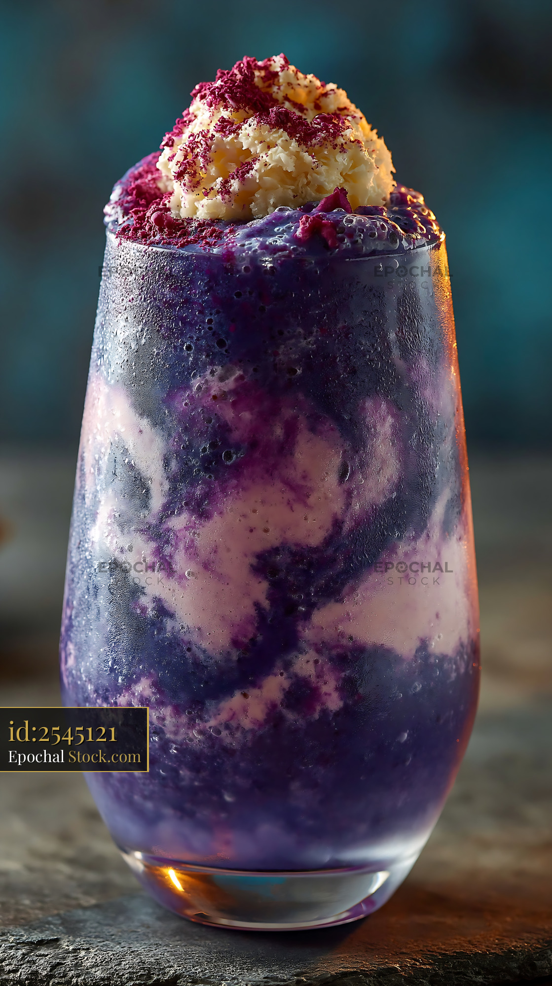 Purple beni imo smoothie with whipped cream in a chilled glass - stock photo