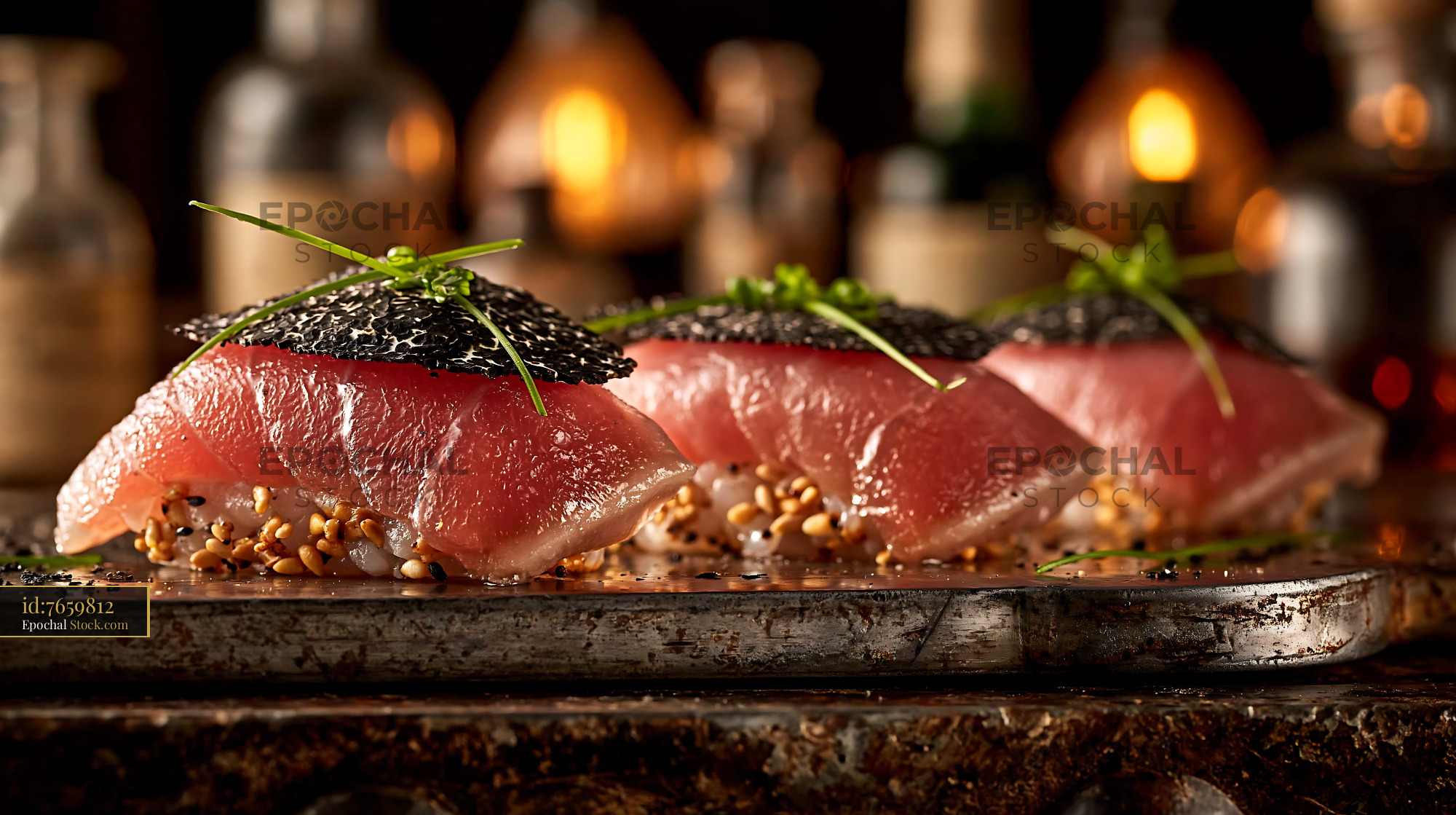 Truffle yellowtail sushi nigiri with chives on a rustic stone plate - stock photo