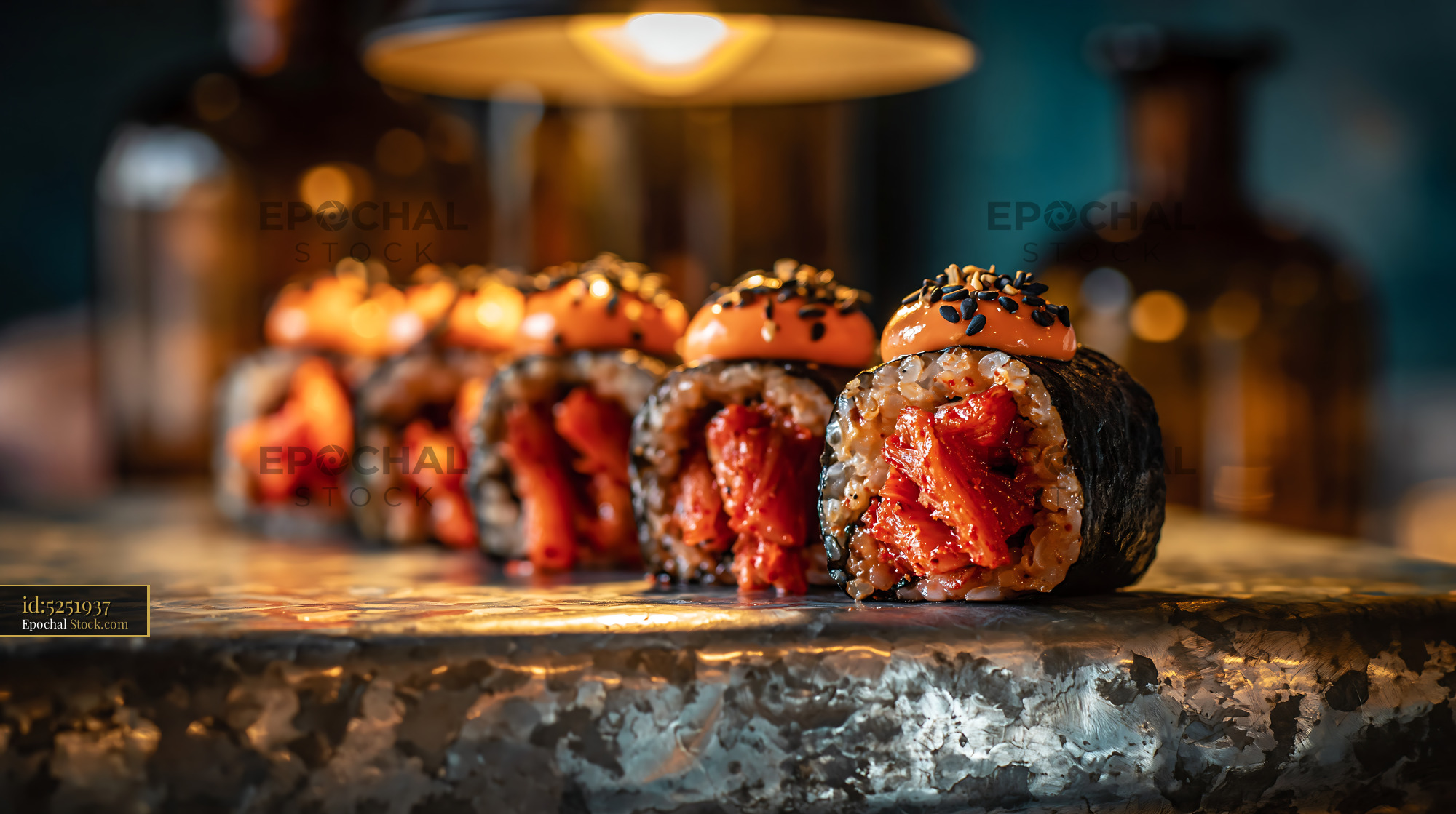 Gourmet kimchi fusion maki sushi rolls served in a moody restaurant - stock photo