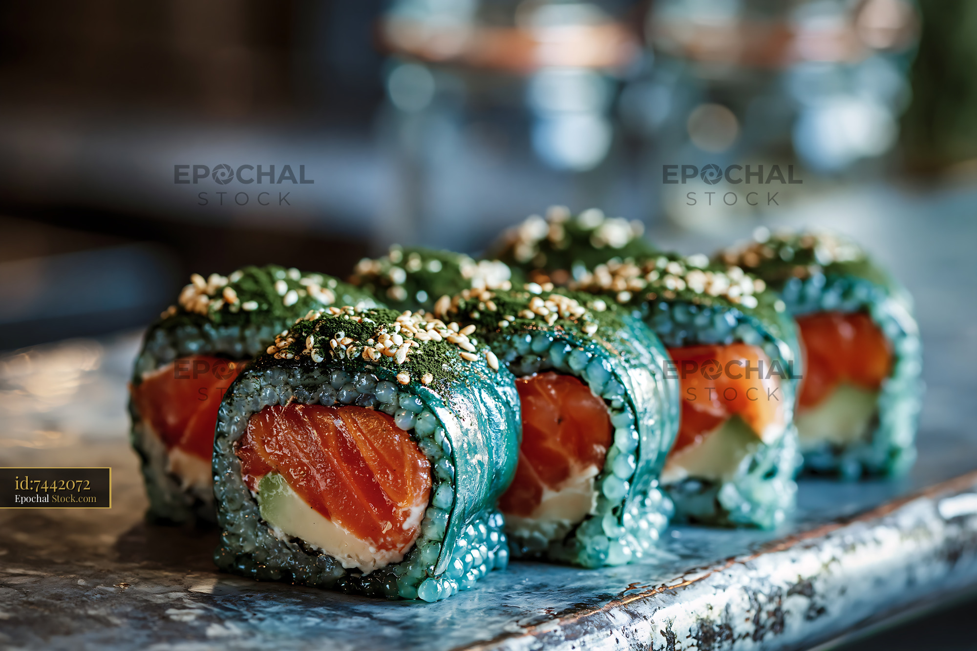 Gourmet spirulina powder sushi rolls with fresh salmon and avocado - stock photo