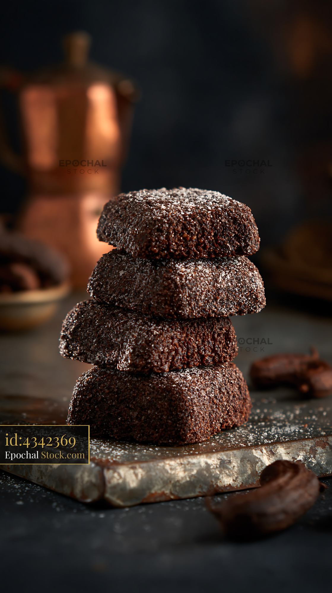 Stack of traditional Lebanese dibs el kharroub biscuits on rustic boar - stock photo