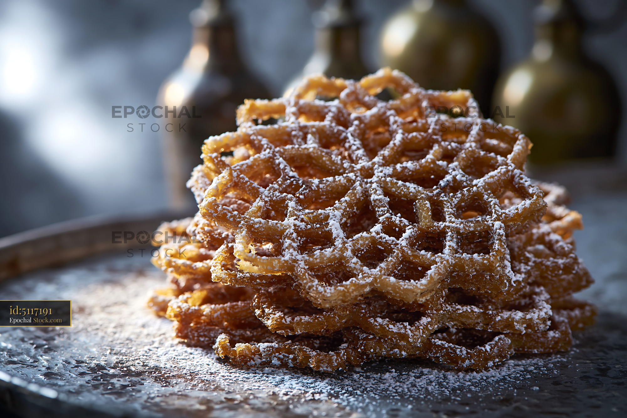 Crispy nan-e panjereh biscuits with powdered sugar on a metal tray - stock photo