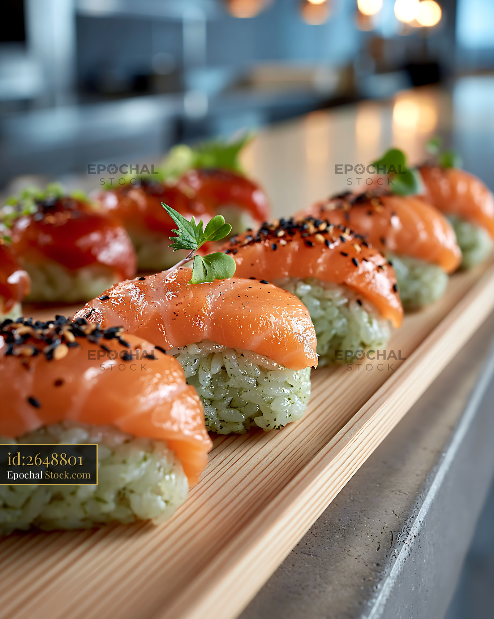 Salmon nigiri with matcha infused rice sushi on a wooden tray - stock photo
