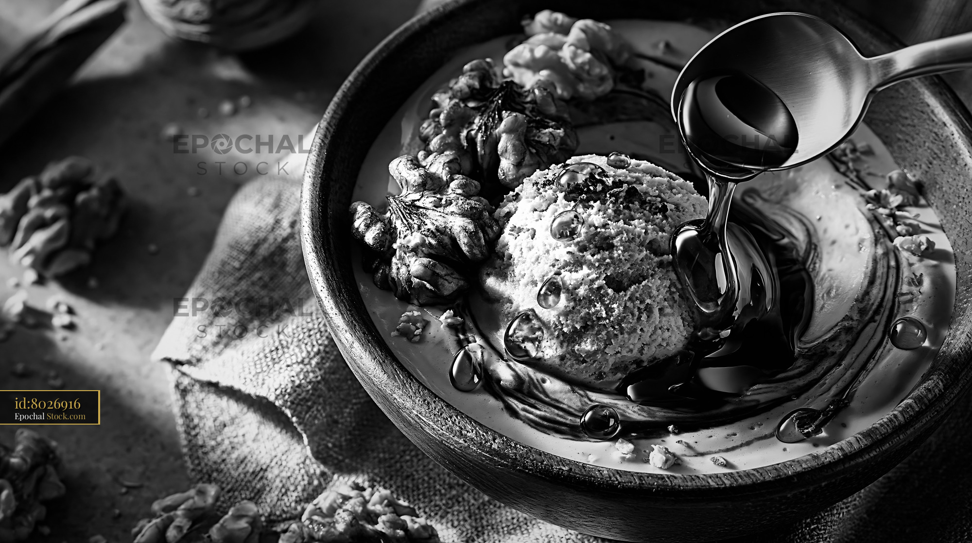Balsamic ice cream with walnuts and dark glaze in a rustic bowl - stock photo