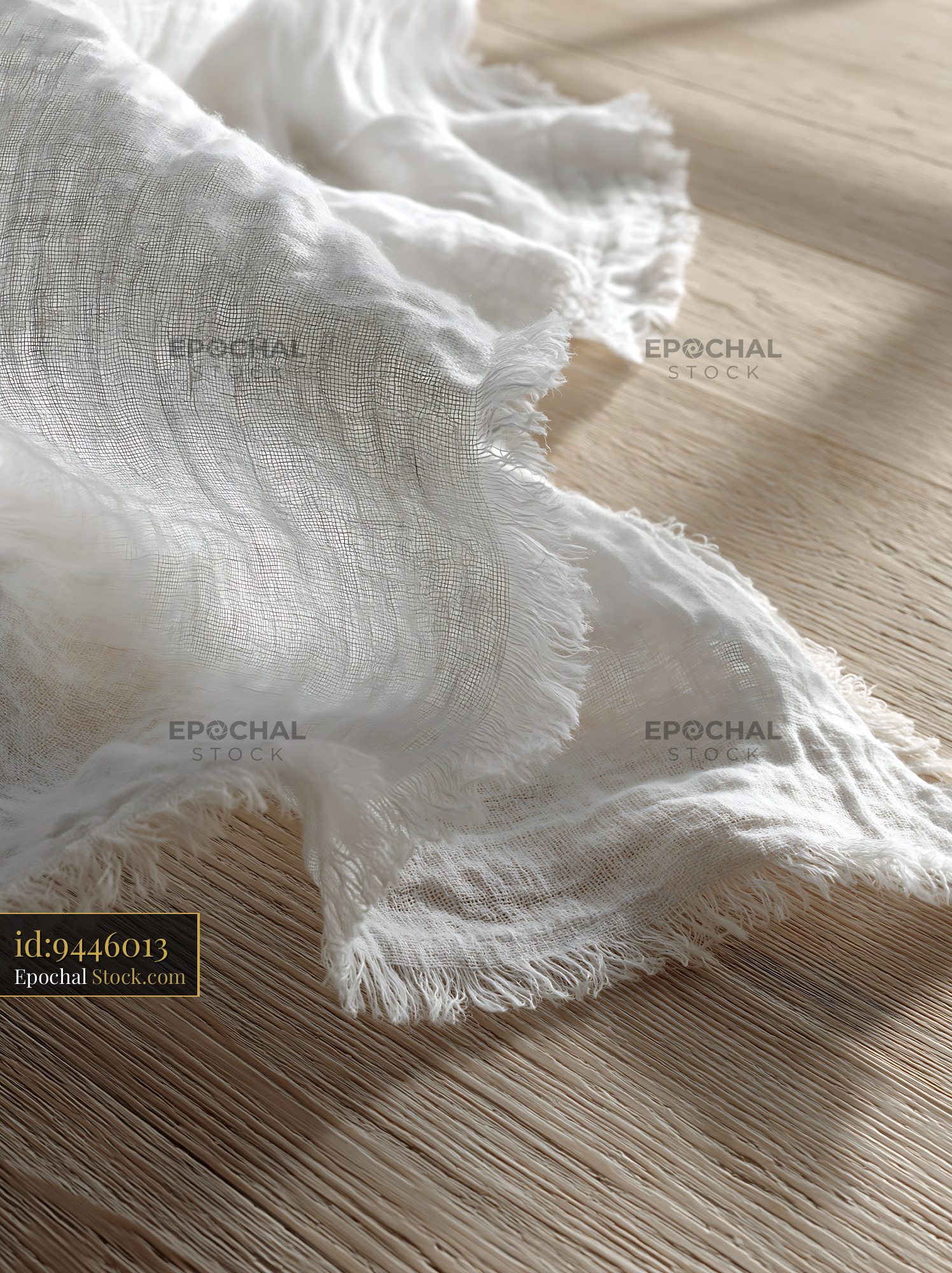 White linen tablecloth on wooden surface for sunflower bouquet setup - stock photo