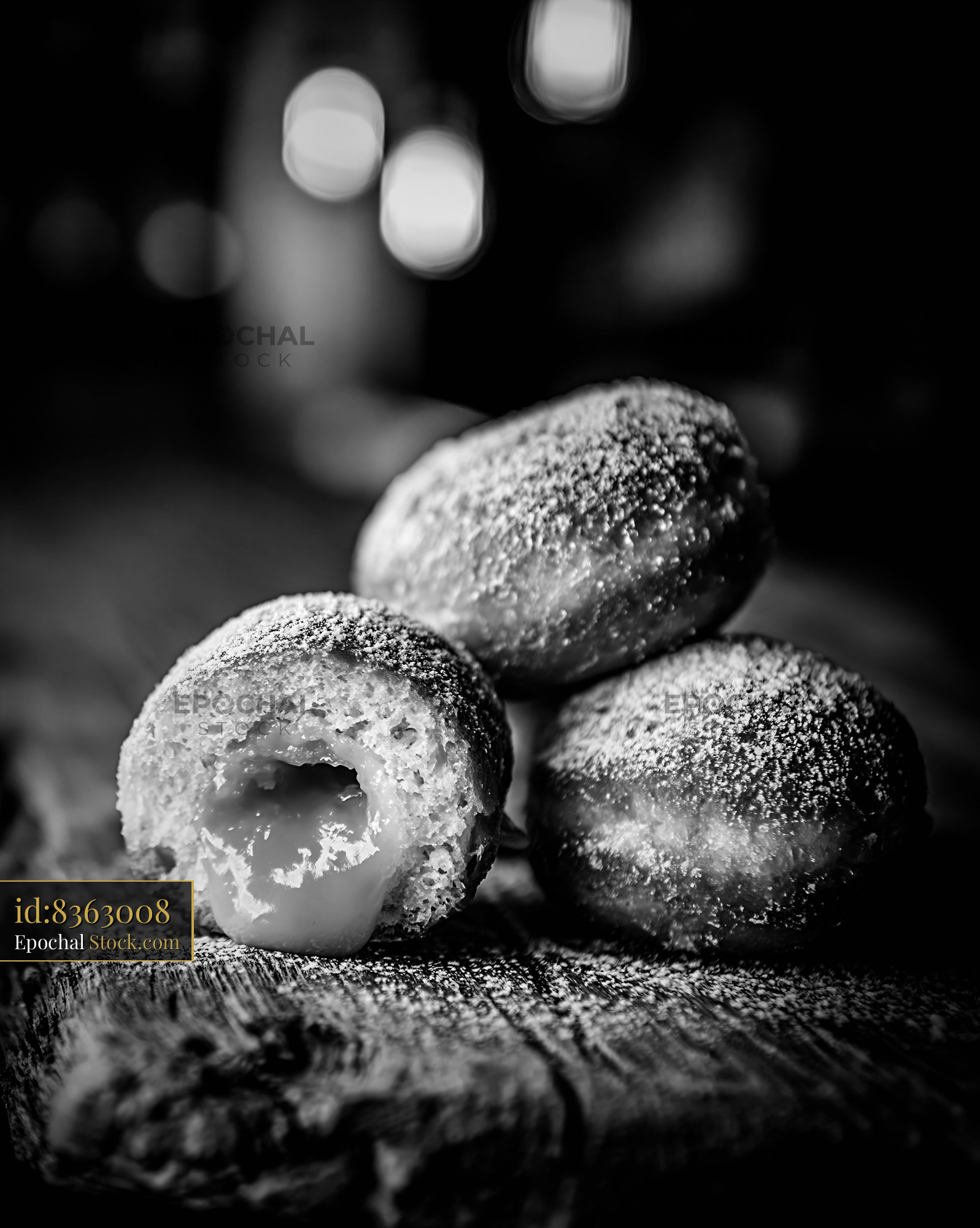 Pandan custard filled donuts with sugar on rustic wooden table - stock photo