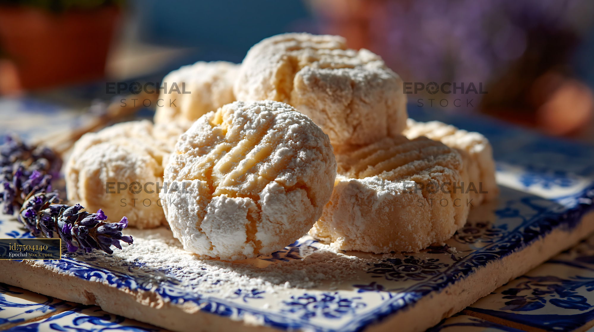 Turkish un kurabiyesi biscuits with powdered sugar on decorative tile - stock photo