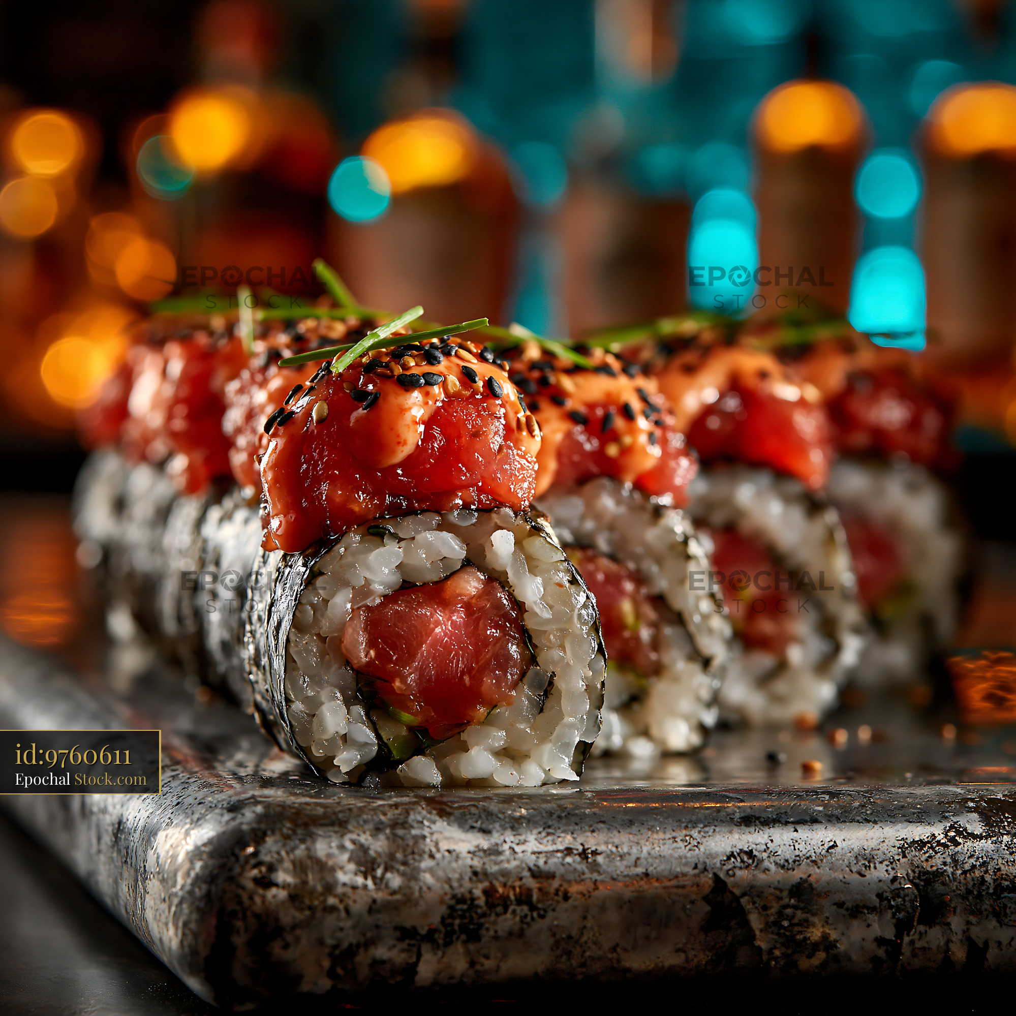 Spicy sriracha mayo tuna sushi rolls served in a vibrant bar setting - stock photo