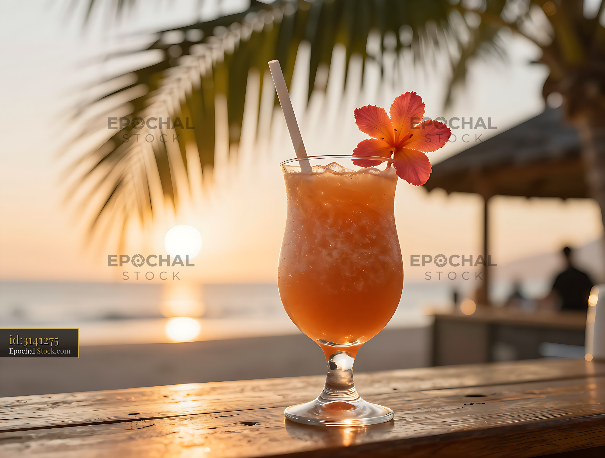Acerola Sunrise smoothie with hibiscus flower on a beach bar at sunset - stock photo