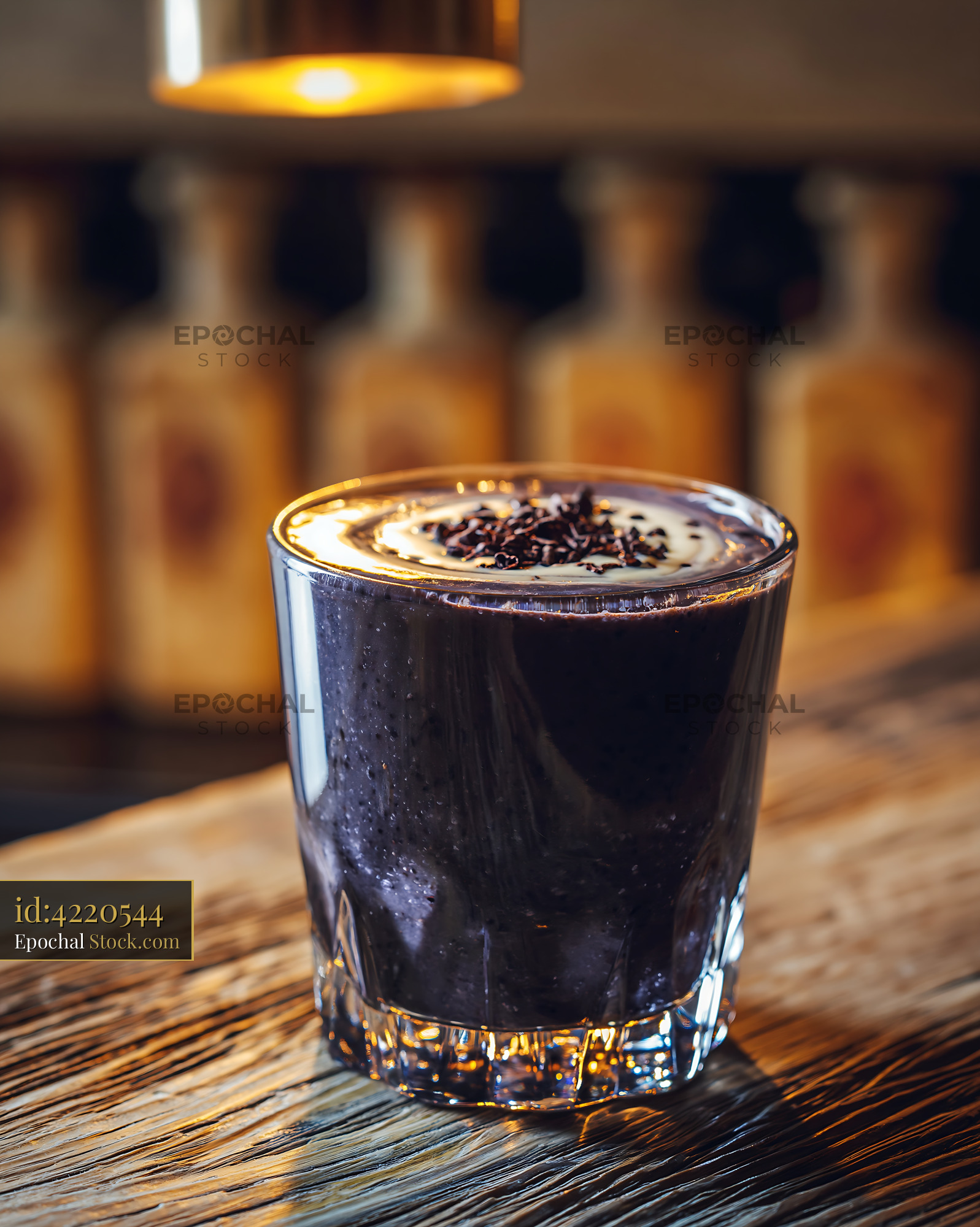 Black bean smoothie with chocolate nibs on a rustic wooden bar - stock photo