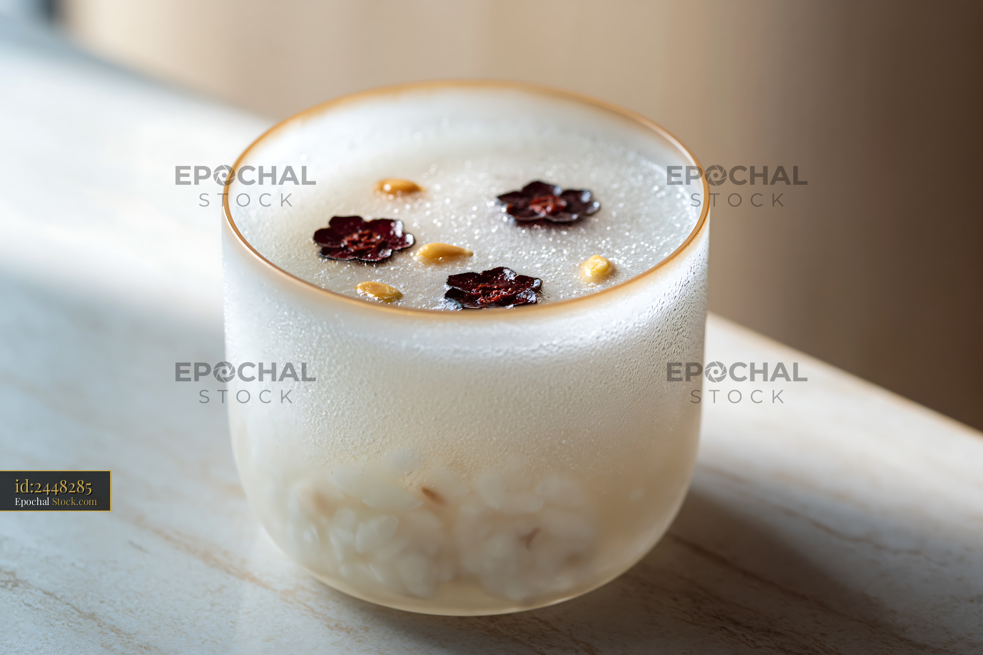 Traditional sikhye rice smoothie with jujube and pine nuts in frosted  - stock photo