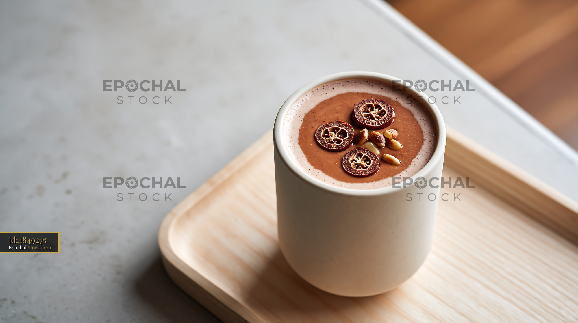 Daechu jujube smoothie topped with dried fruit slices and pine nuts - stock photo