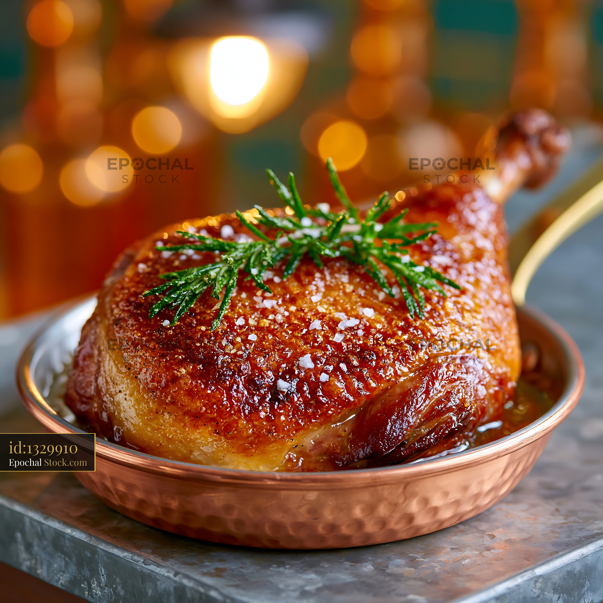 Roasted confit de canard meat with crispy skin in a copper pan - stock photo