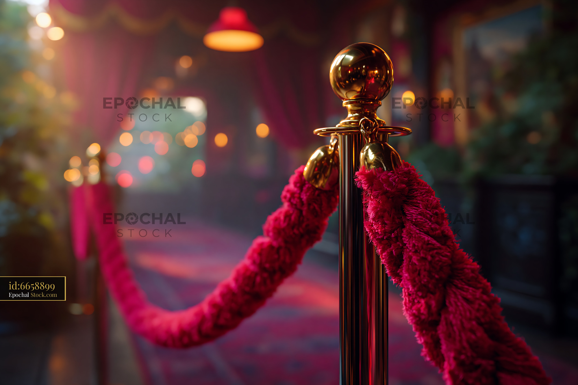 Red velvet rope vip area with golden stanchion at luxury event - stock photo
