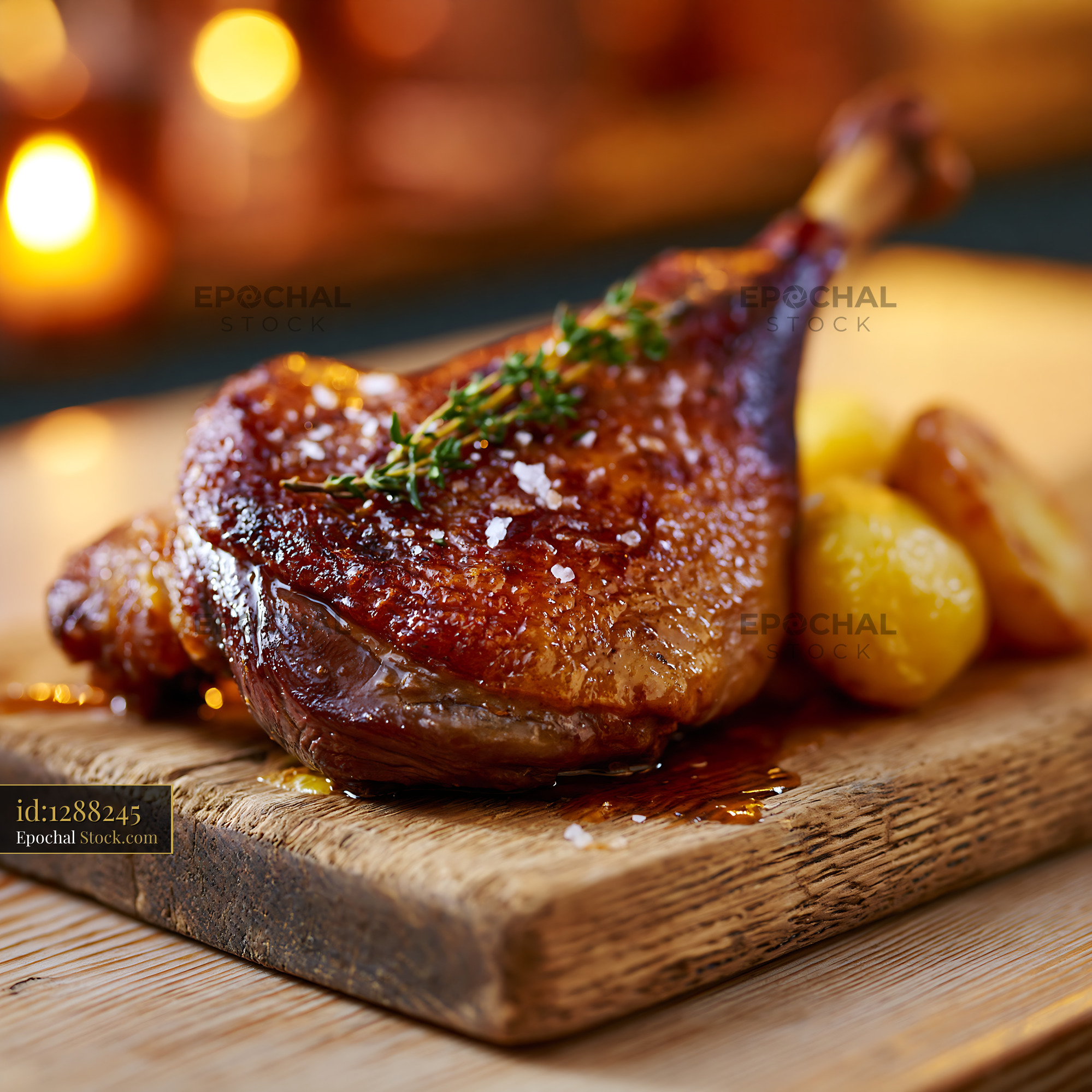 Roasted jamon iberico de bellota meat leg with crispy skin and potatoe - stock photo