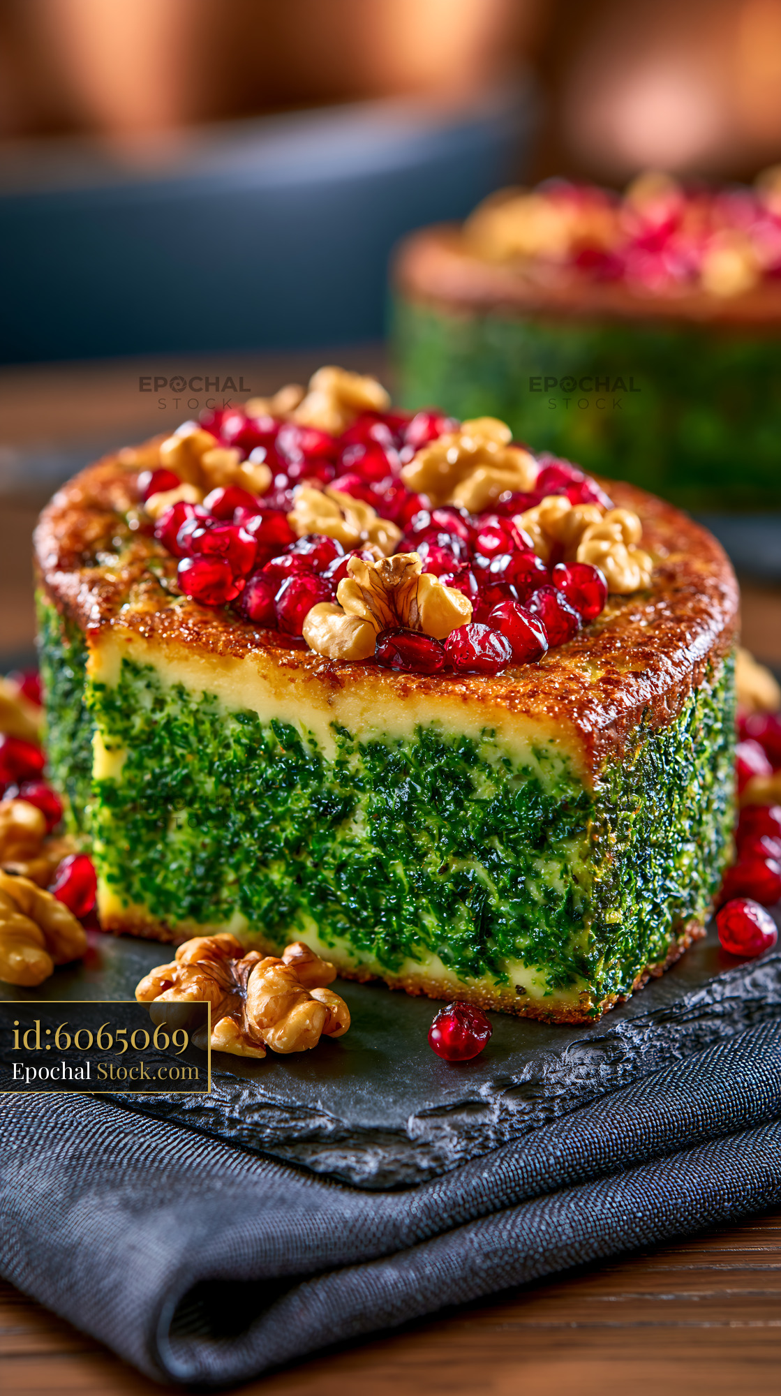 Traditional Persian kuku sabzi with pomegranate and walnuts - stock photo
