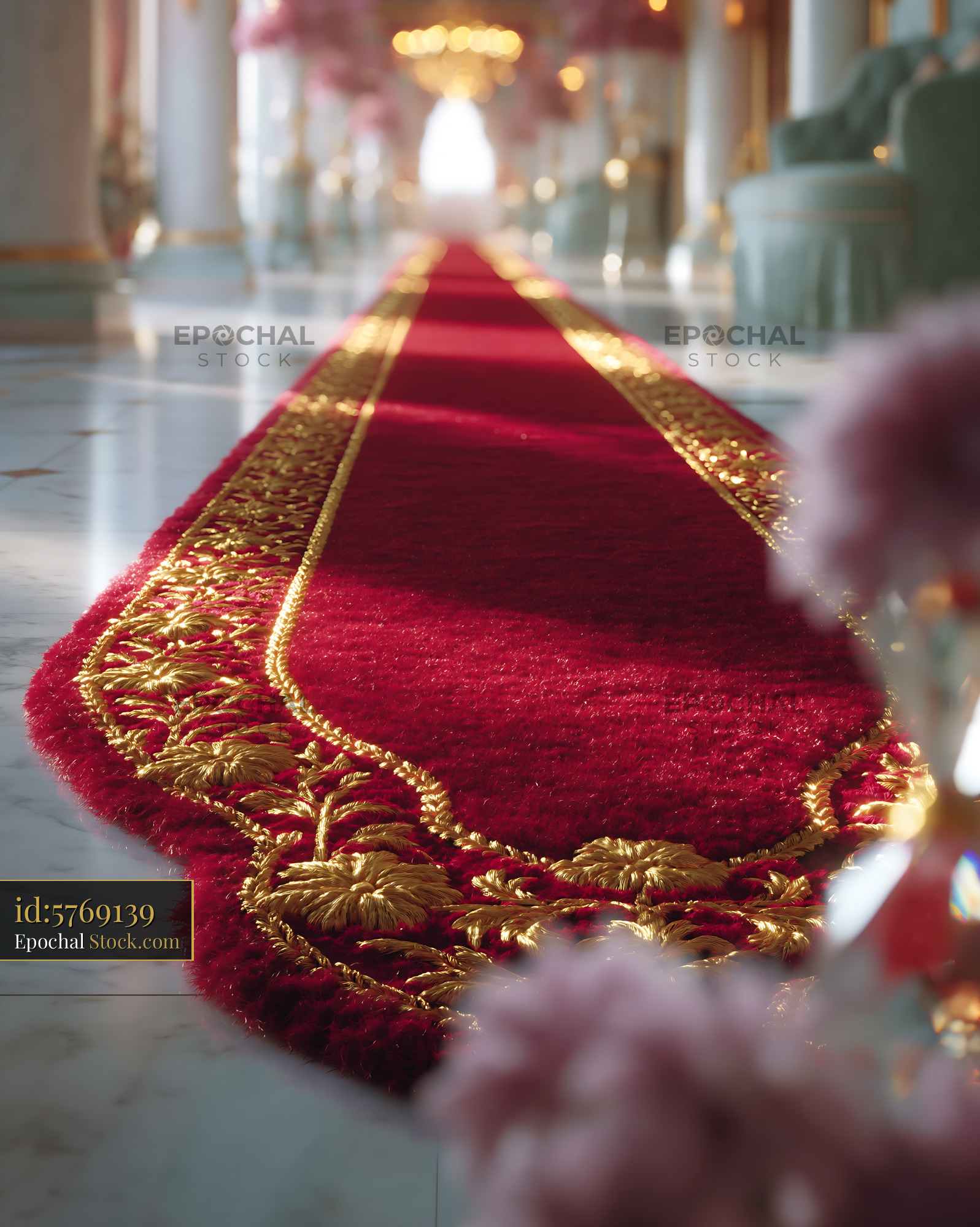 Ornate red velvet carpet with gold fringe in luxury palace hallway - stock photo