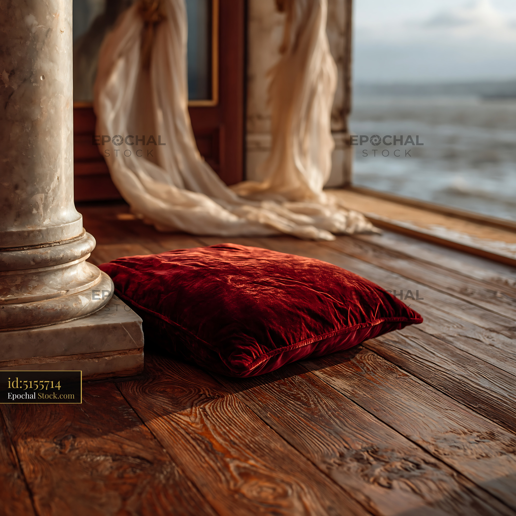 Red velvet cushion on wooden terrace of a luxury hotel balcony - stock photo