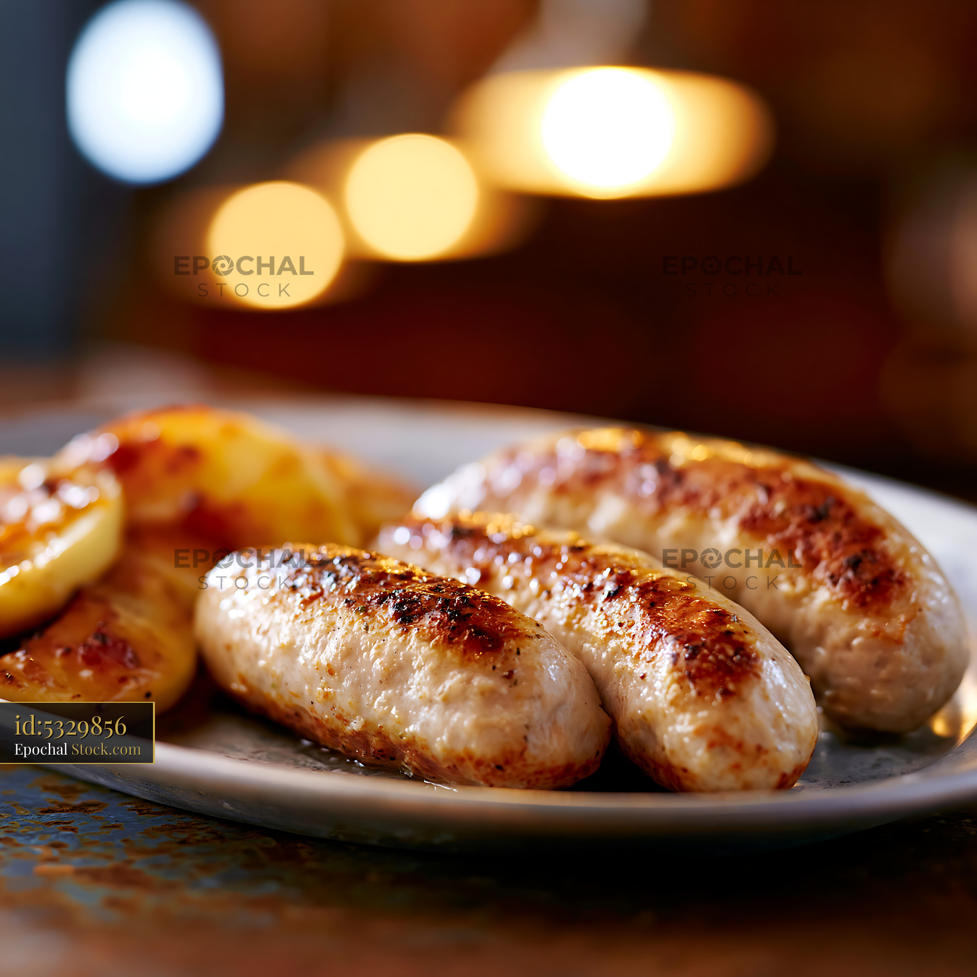 Grilled boudin blanc meat sausages with potatoes on a white plate - stock photo
