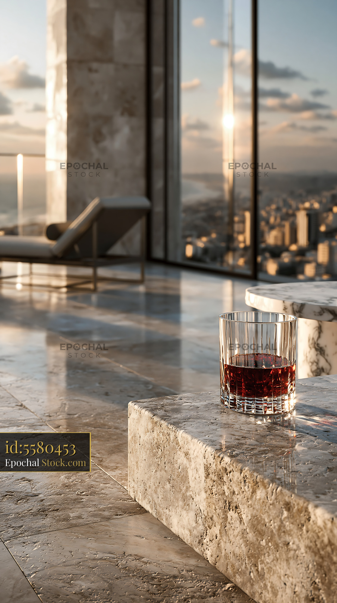 Glass of whiskey on marble table in luxury penthouse at sunset - stock photo