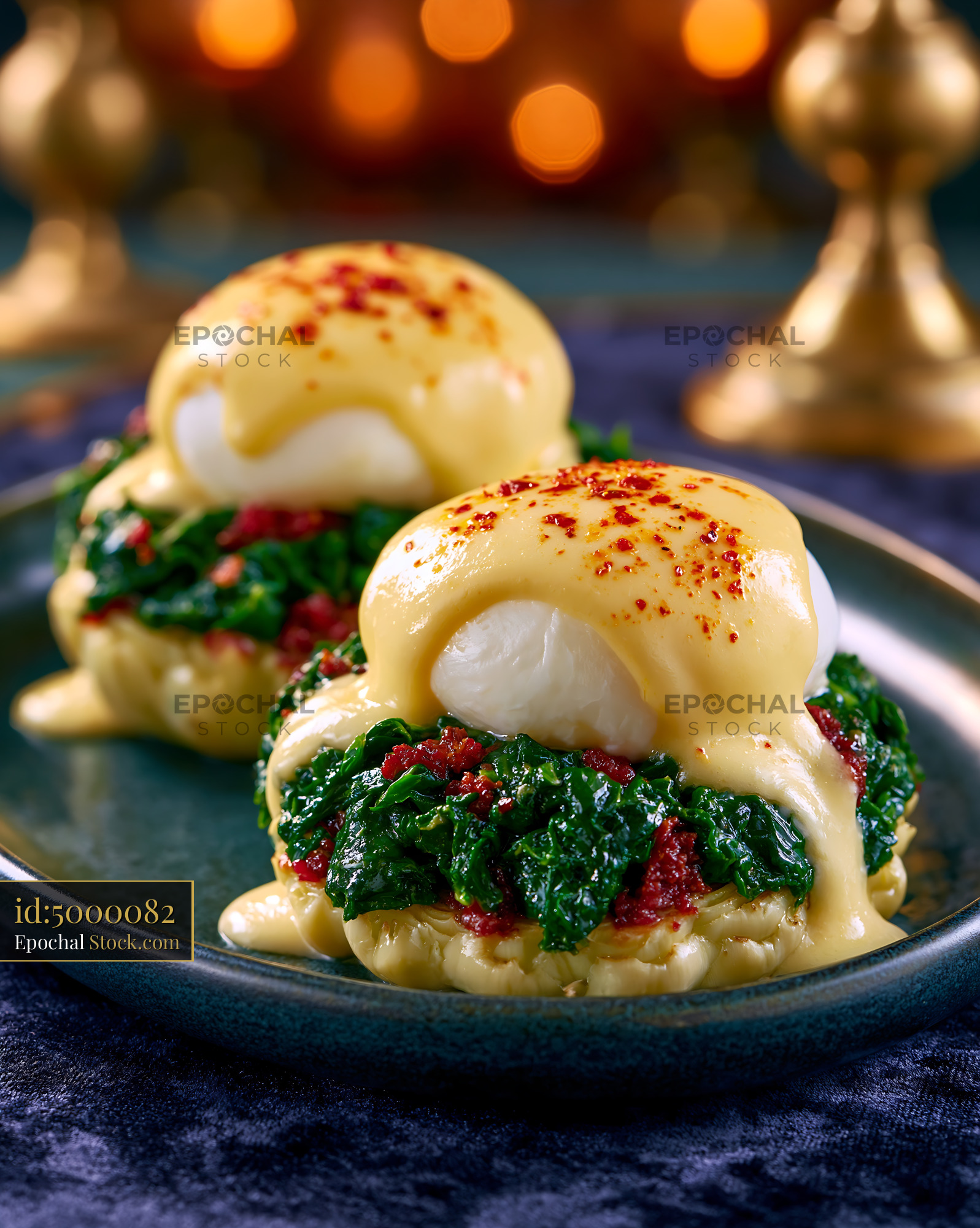 Gourmet eggs sardou with hollandaise sauce and spinach on artichoke - stock photo