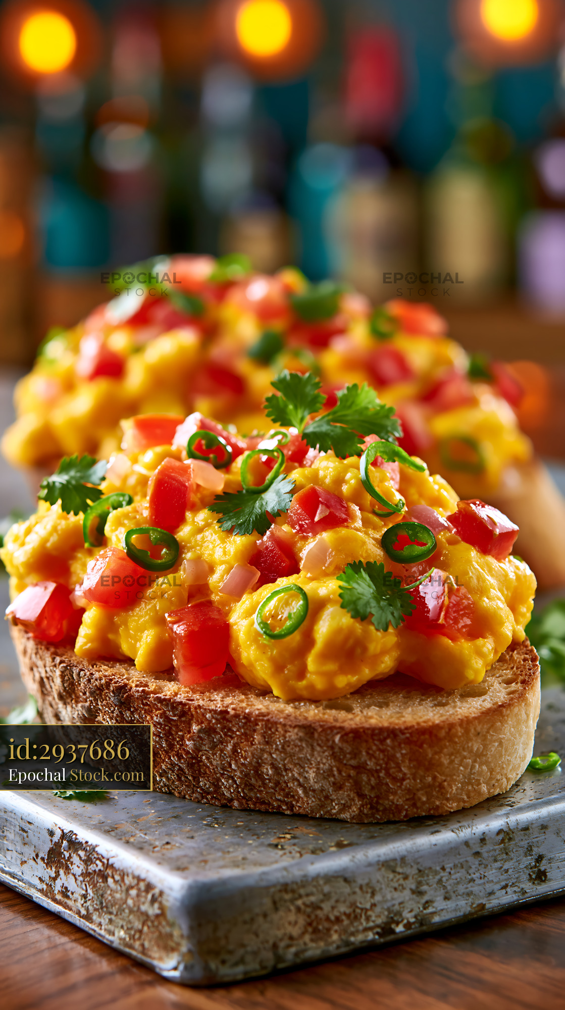 Akuri egg food on toasted sourdough with fresh chilies and cilantro - stock photo