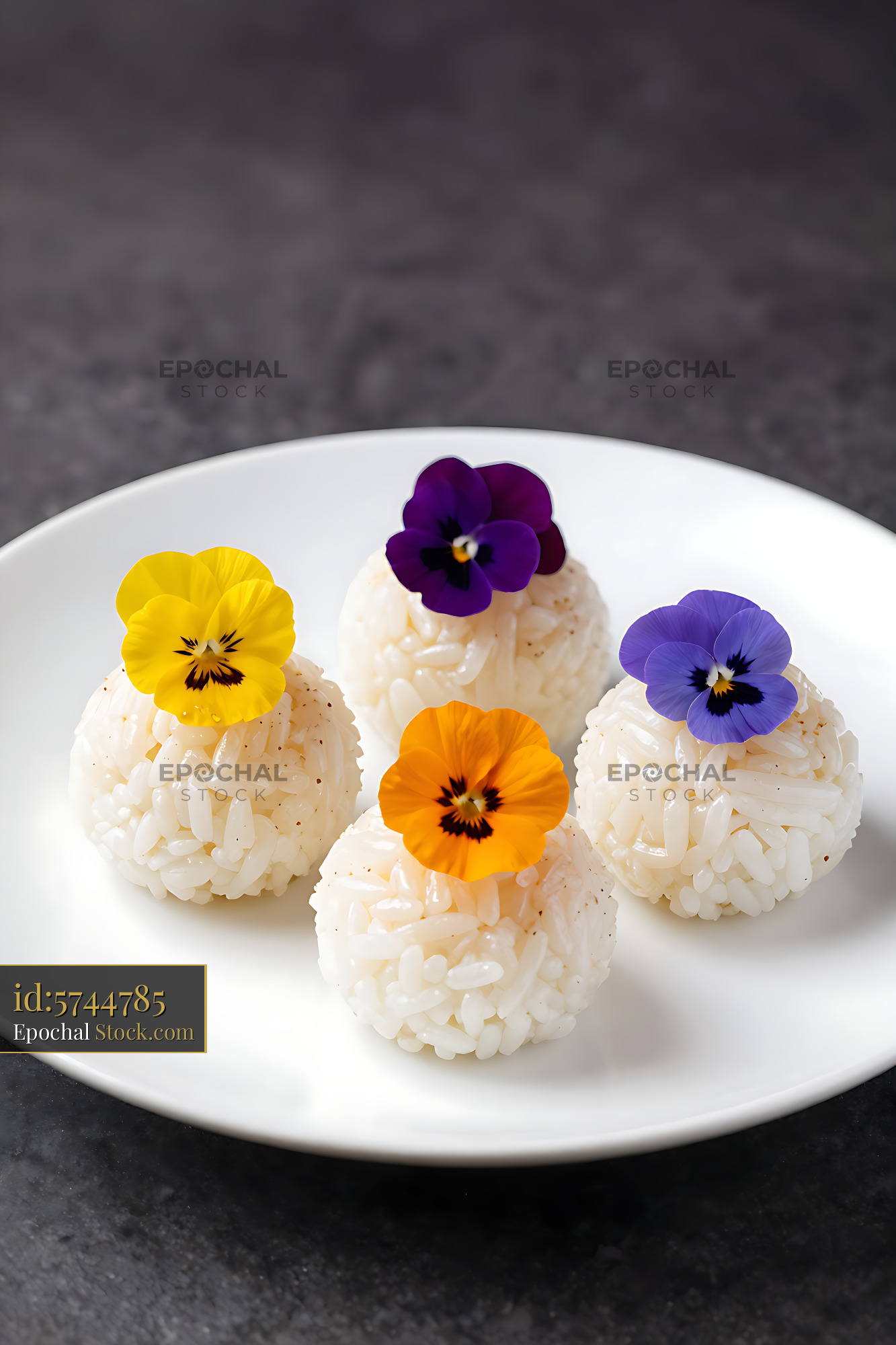 Japanese temari rice balls decorated with colorful edible pansy flower - stock photo