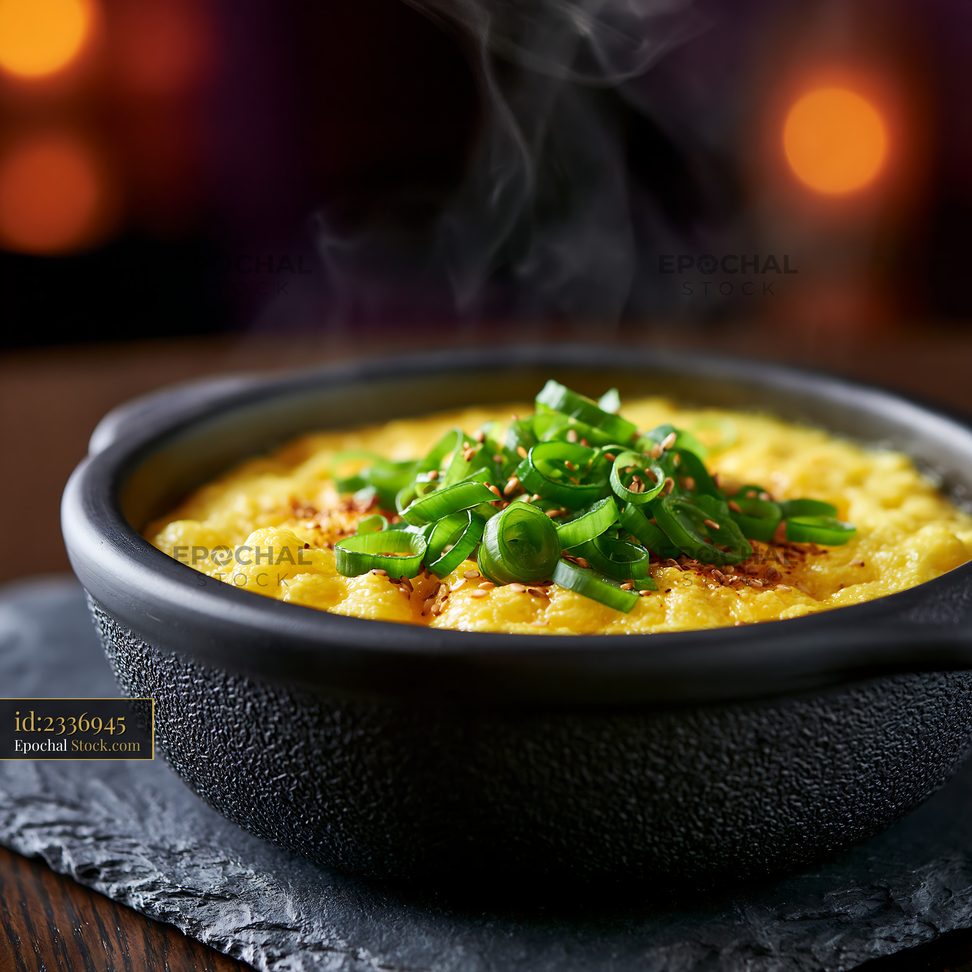 Steaming Korean steamed egg gyeran jjim with fresh scallions - stock photo