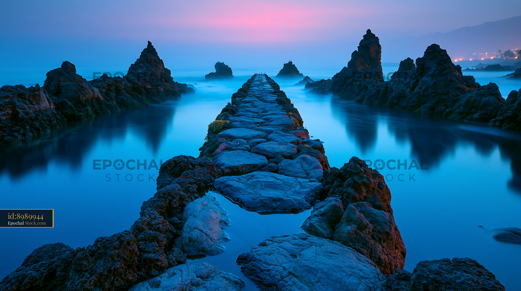 Stone path leading through volcanic rocks at Los Cancajos La Palma - stock photo