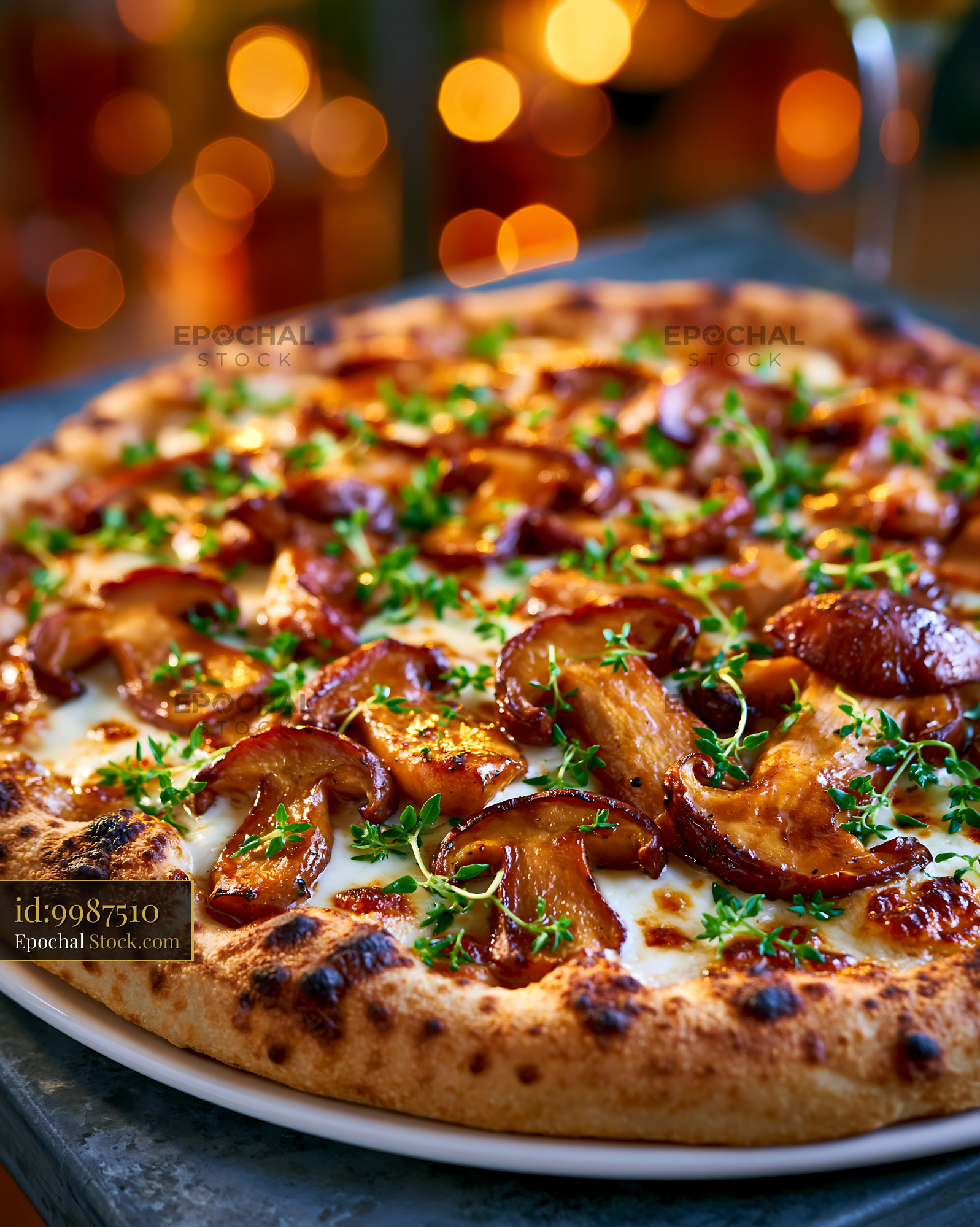 Artisanal porcini mushroom pizza with fresh thyme and melted cheese - stock photo