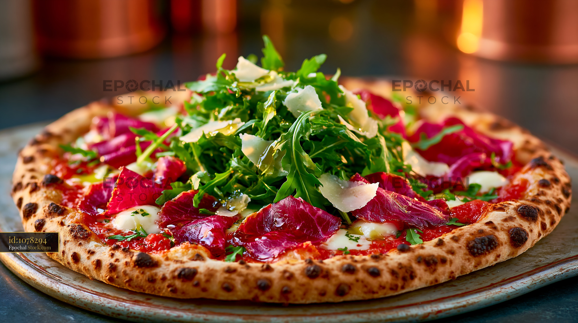 Gourmet bresaola rucola pizza with parmesan and fresh arugula - stock photo