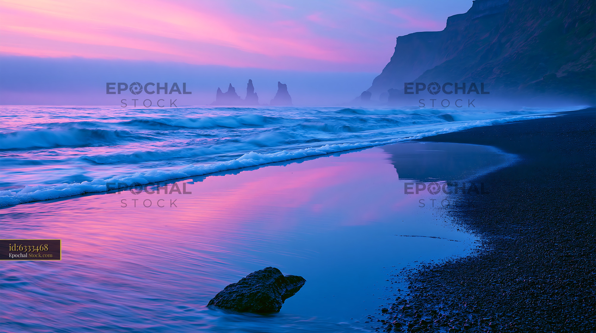 Dramatic sunset over Reynisfjara black sand beach and sea stacks - stock photo