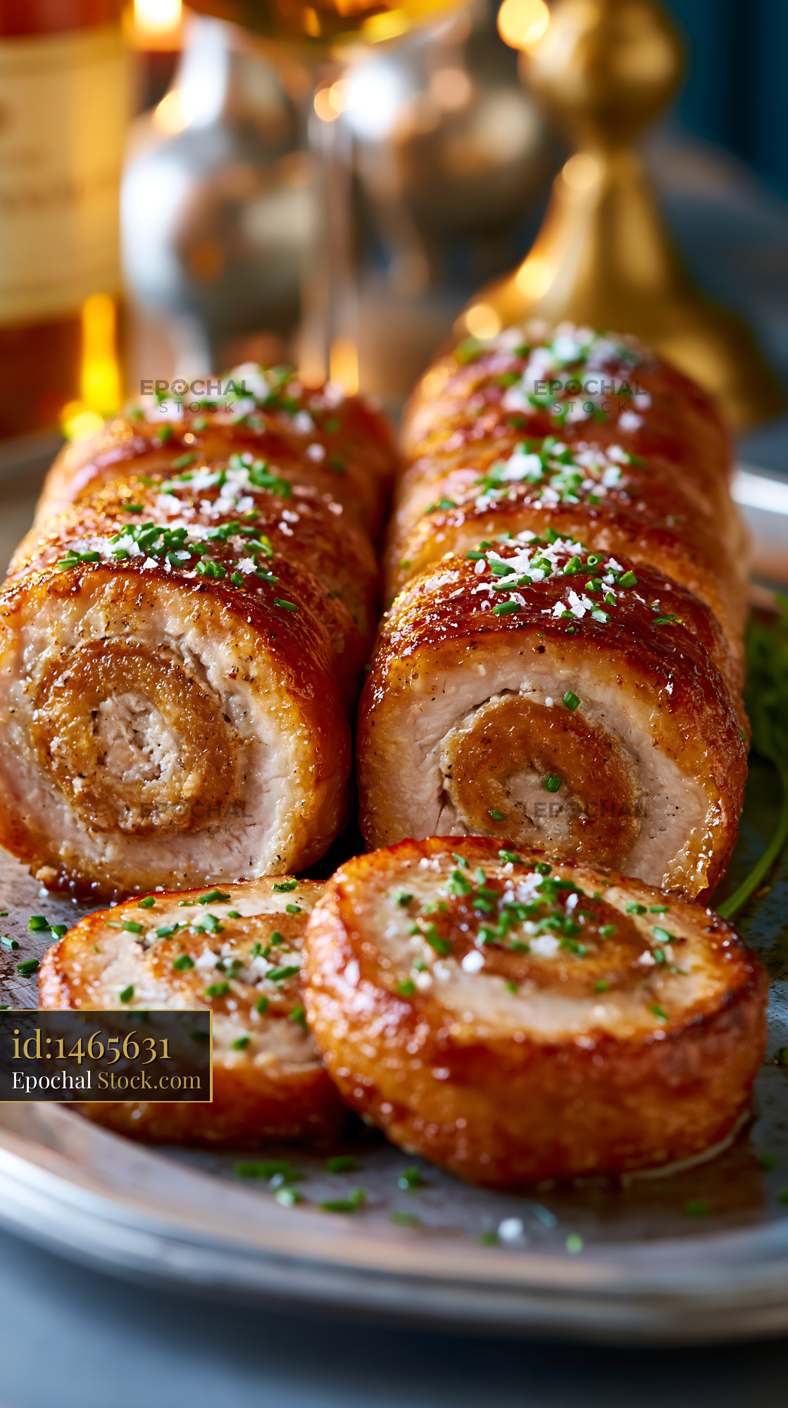 Roasted andouillette de troyes meat with crispy skin and chives - stock photo