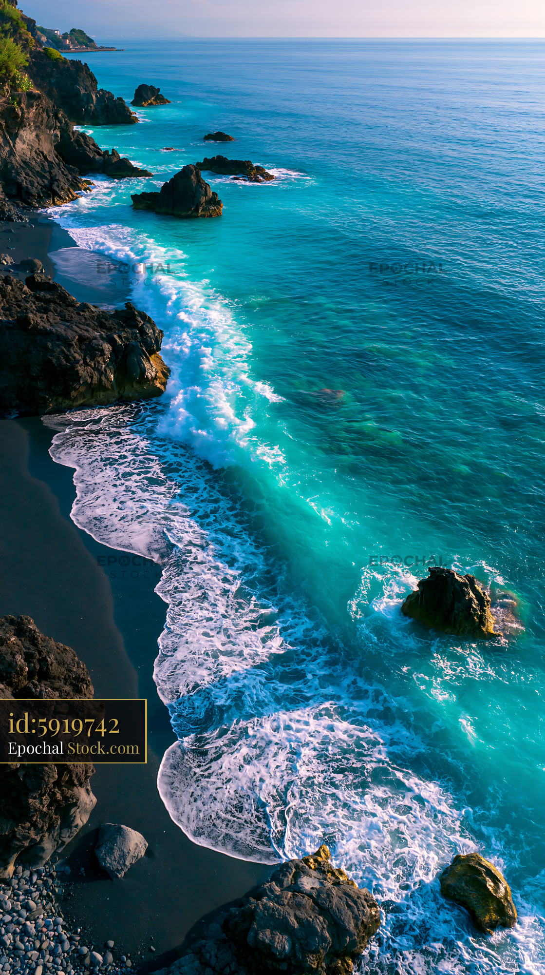 Turquoise waves crashing against volcanic sulfur stained beach rocks - stock photo