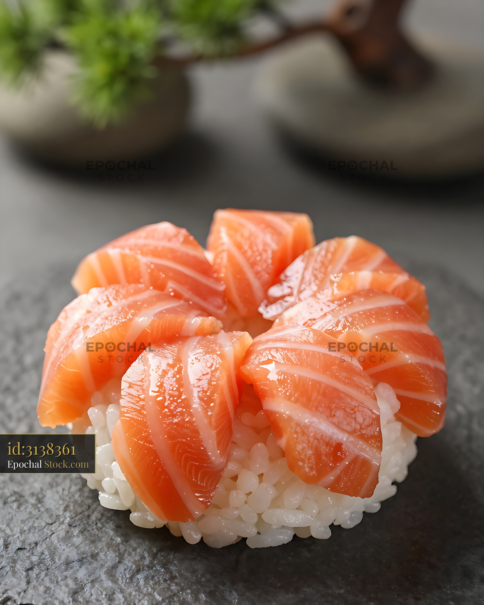 Fresh salmon sakura temarizushi served on a dark stone plate - stock photo