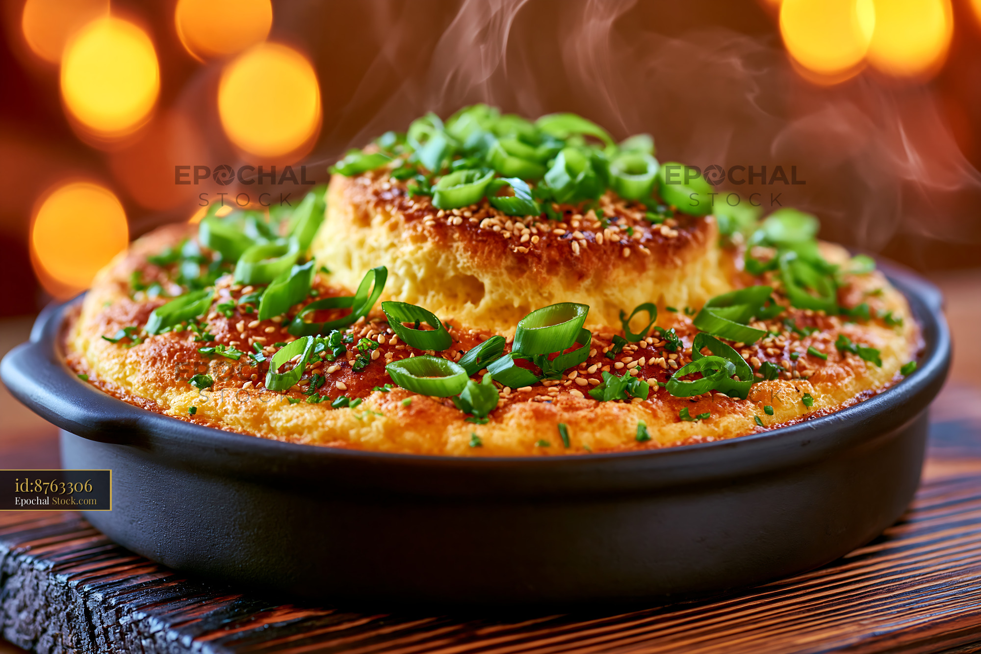 Steaming gyeran jjim egg food topped with fresh green onions - stock photo