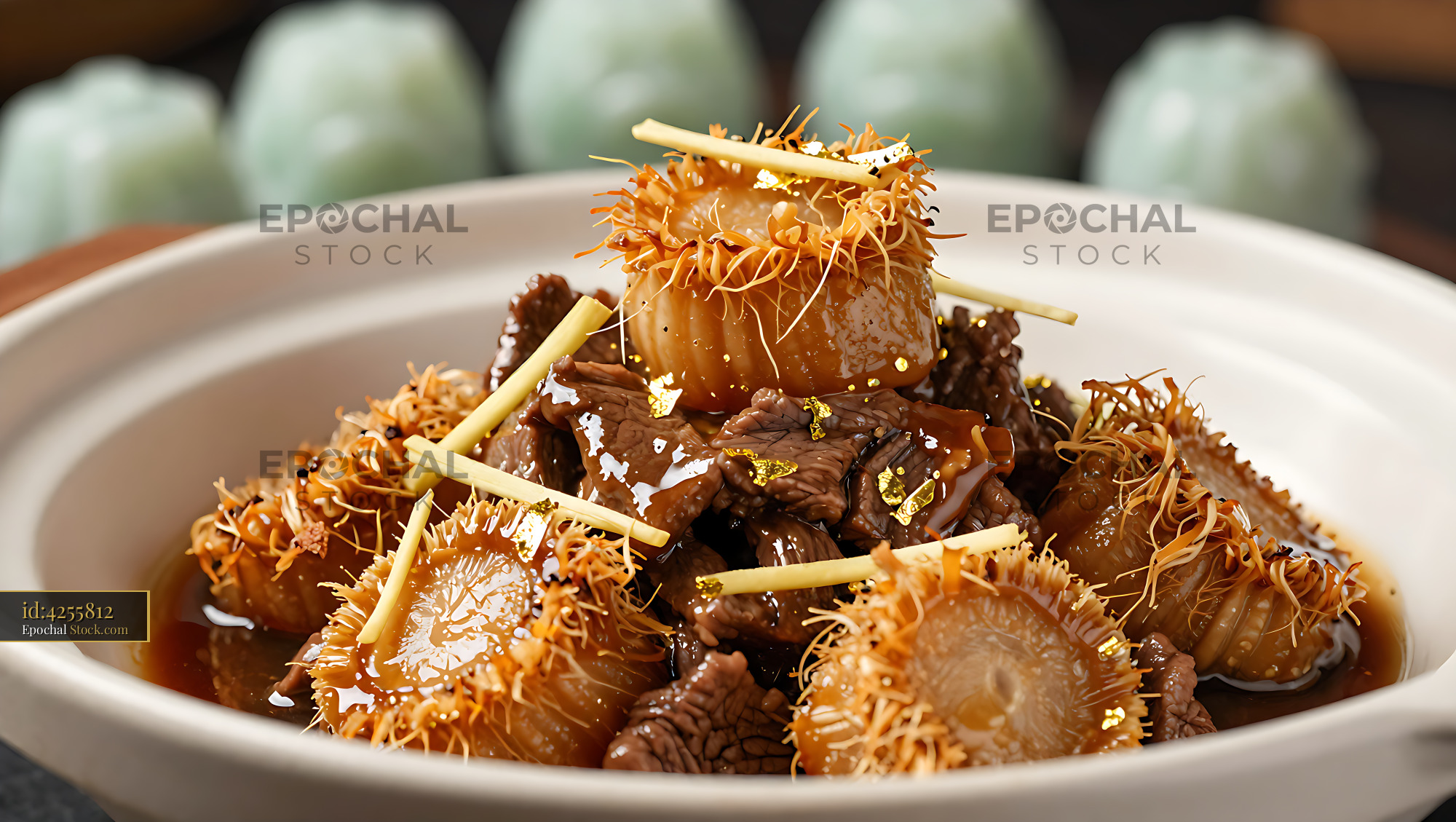Braised beef and conpoy clay pot with gold leaf in a ceramic bowl - stock photo